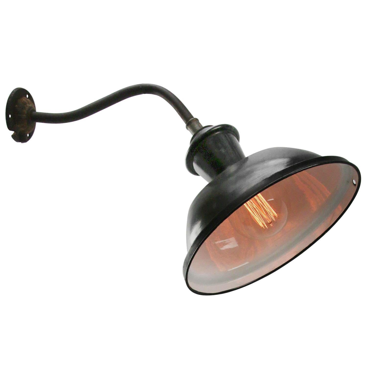 French Industrial wall light
Black enamel, white interior

diameter cast iron wall piece: 8 cm, 3 holes to secur

Weight: 1.20 kg / 2.6 lb

Priced per individual item. All lamps have been made suitable by international standards for