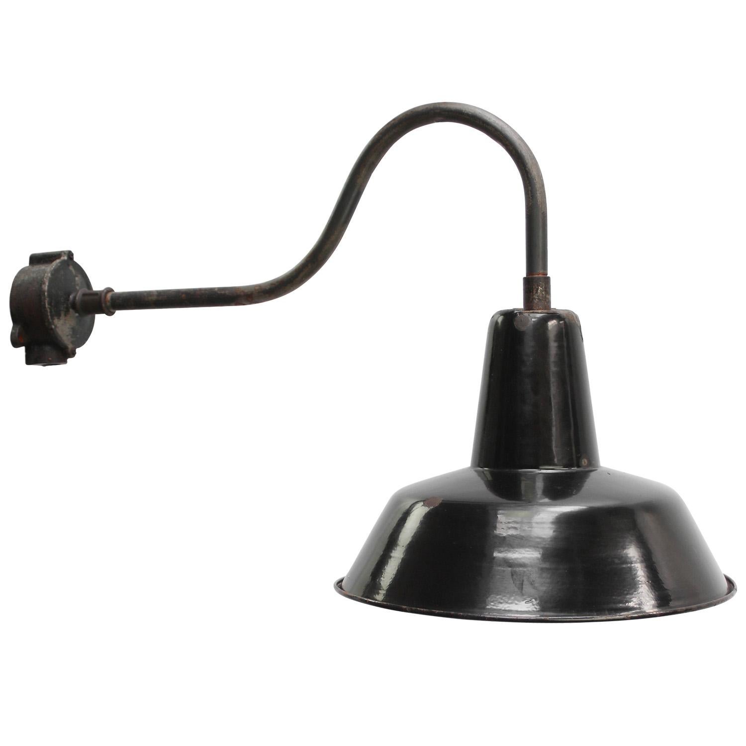 French factory wall light
Black enamel, white interior

diameter cast iron wall piece: 10.5 cm, 2 holes to secure

Shipped in 2 parts

Weight: 1.80 kg / 4 lb

Priced per individual item. All lamps have been made suitable by international