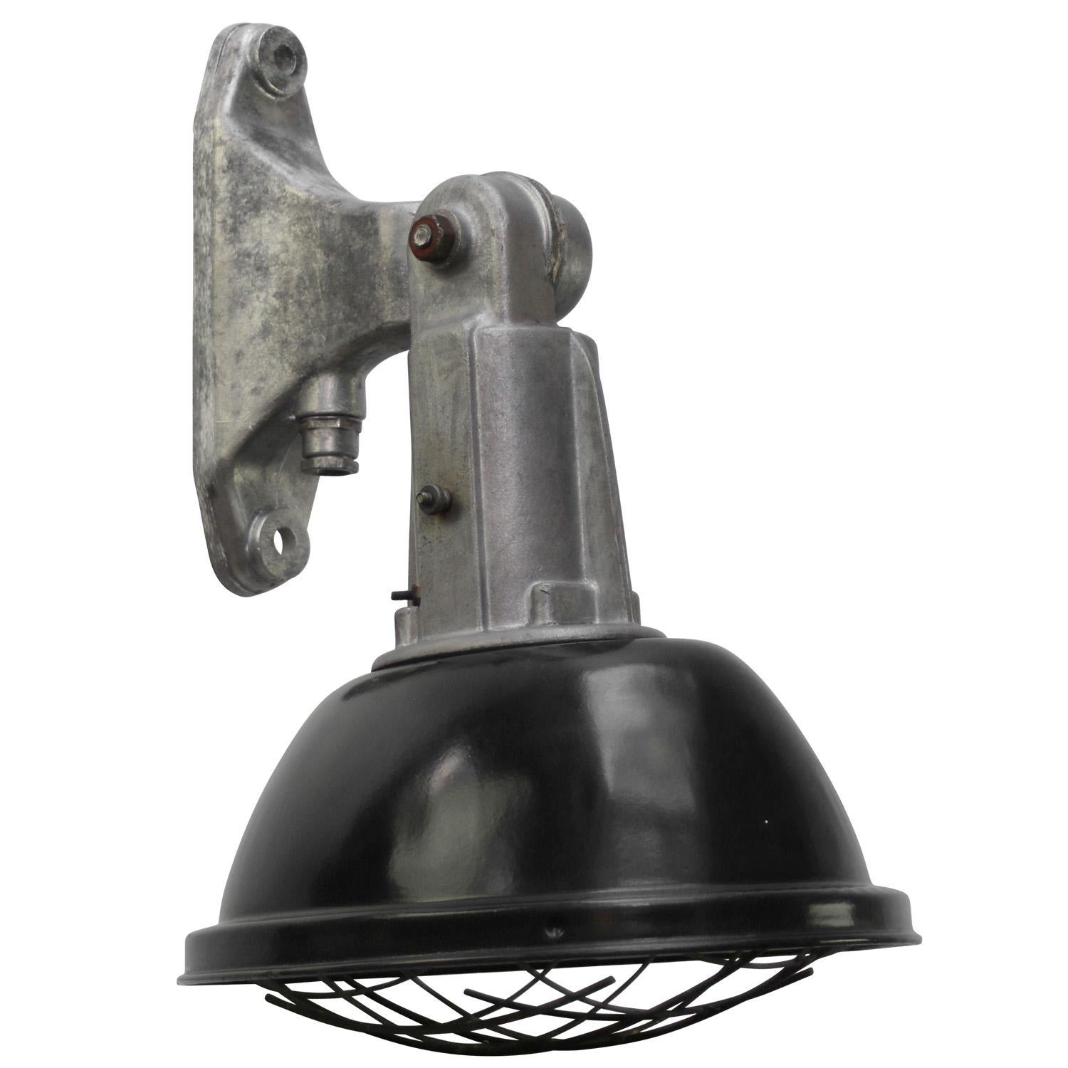 French industrial wall light. Cast aluminium wall pieces with black enamel shade.

Weight: 2.40 kg / 5.3 lb

Priced per individual item. All lamps have been made suitable by international standards for incandescent light bulbs, energy-efficient and