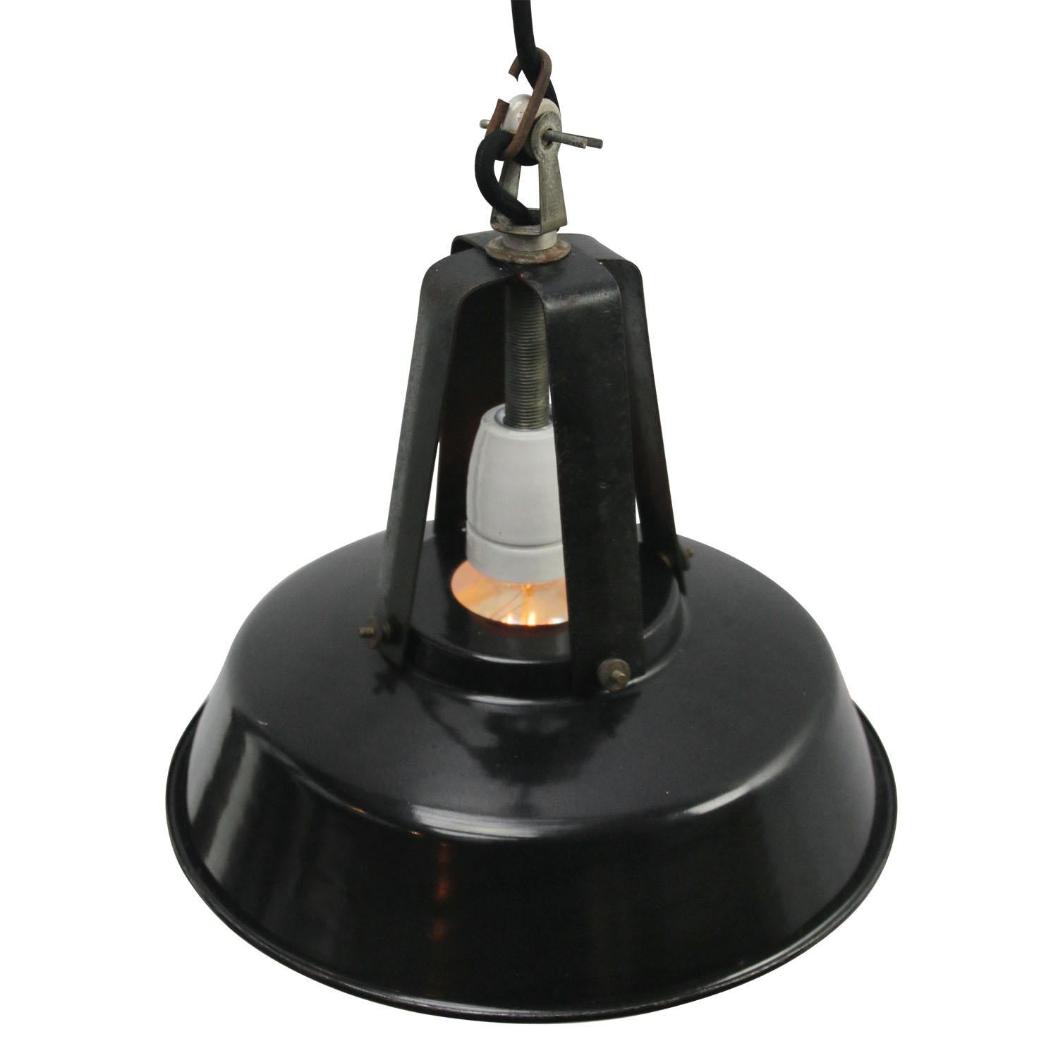 French factory light.
Black iron top with enamel shade.
White inside.

Weight: 1.00 kg / 2.2 lb

Priced per individual item. All lamps have been made suitable by international standards for incandescent light bulbs, energy-efficient and LED