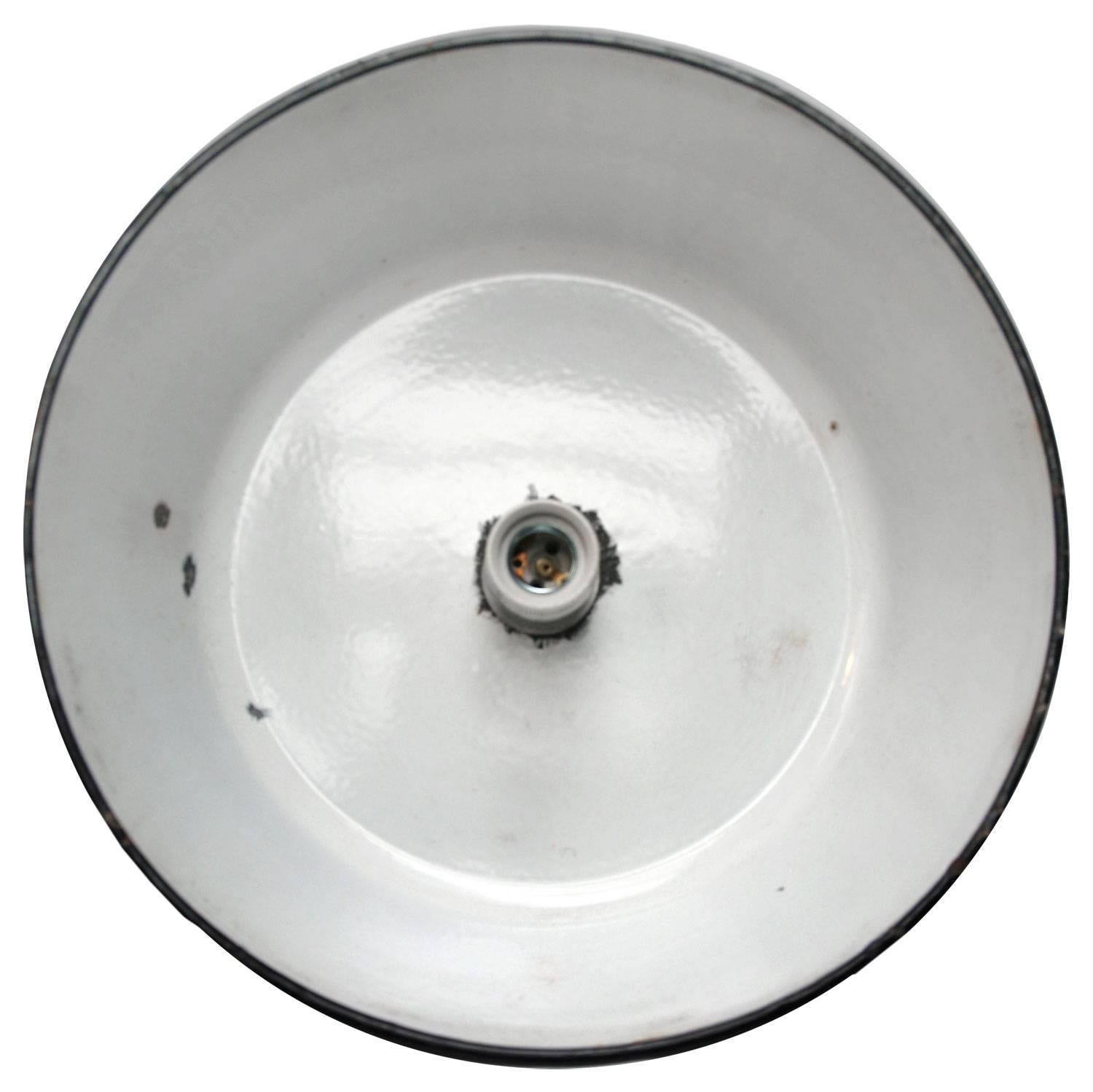 French Industrial pendant. Black enamel with white inside.

Measures: Weight 1.2 kg / 2.6 lb

Priced per individual item. All lamps have been made suitable by international standards for incandescent light bulbs, energy-efficient and LED bulbs.