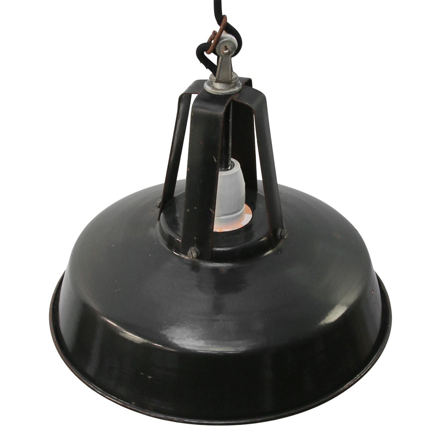 French factory light.
Black iron top with enamel shade.
White inside.

Weight: 1.20 kg / 2.6 lb

Priced per individual item. All lamps have been made suitable by international standards for incandescent light bulbs, energy-efficient and LED