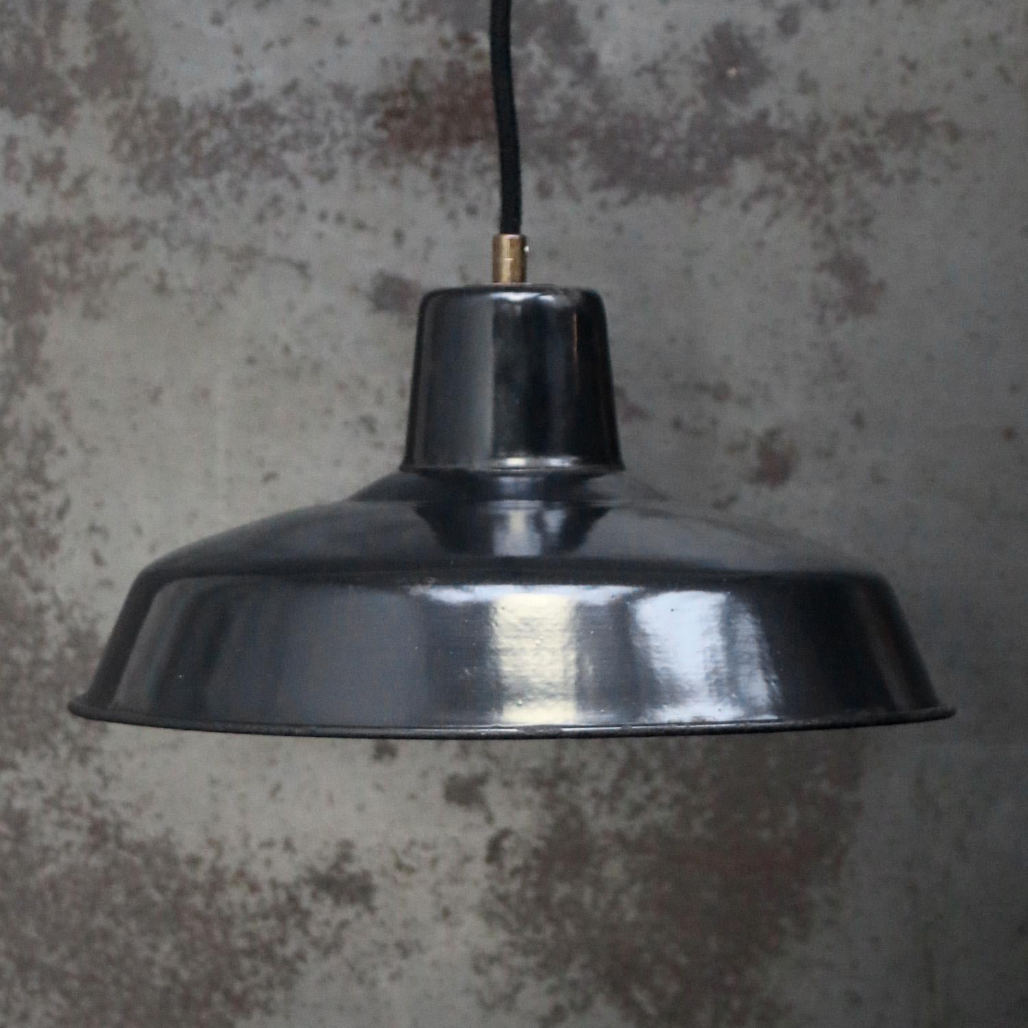 French factory pendant light
Black enamel, white interior

Weight: 1.00 kg / 2.2 lb

Priced per individual item. All lamps have been made suitable by international standards for incandescent light bulbs, energy-efficient and LED bulbs. E26/E27 bulb