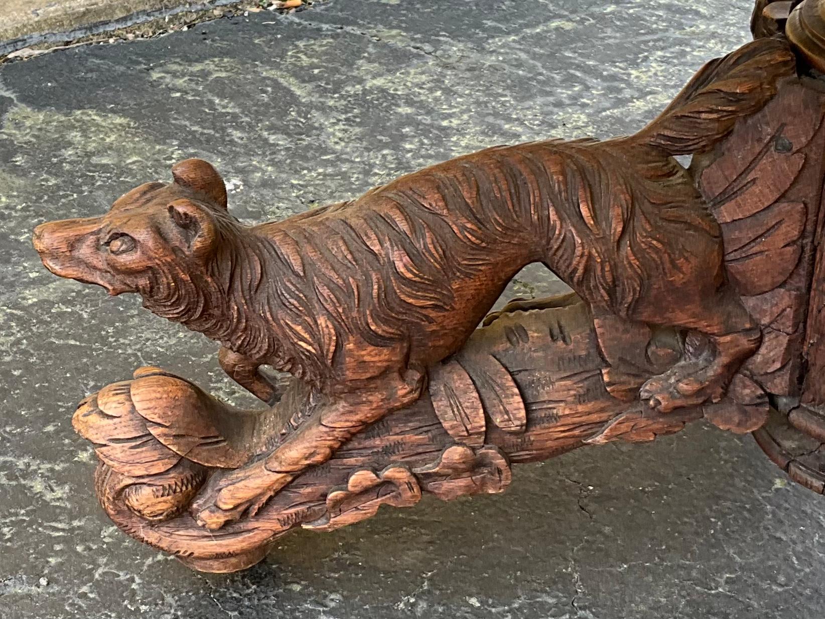 This is fabulous! This is a 19th century French carved oak Black Forest style heavily carved table. It could work as either a center table or as a dining table. It does not have leaves. The table has four legs on casters. Each leg has a carved hunt