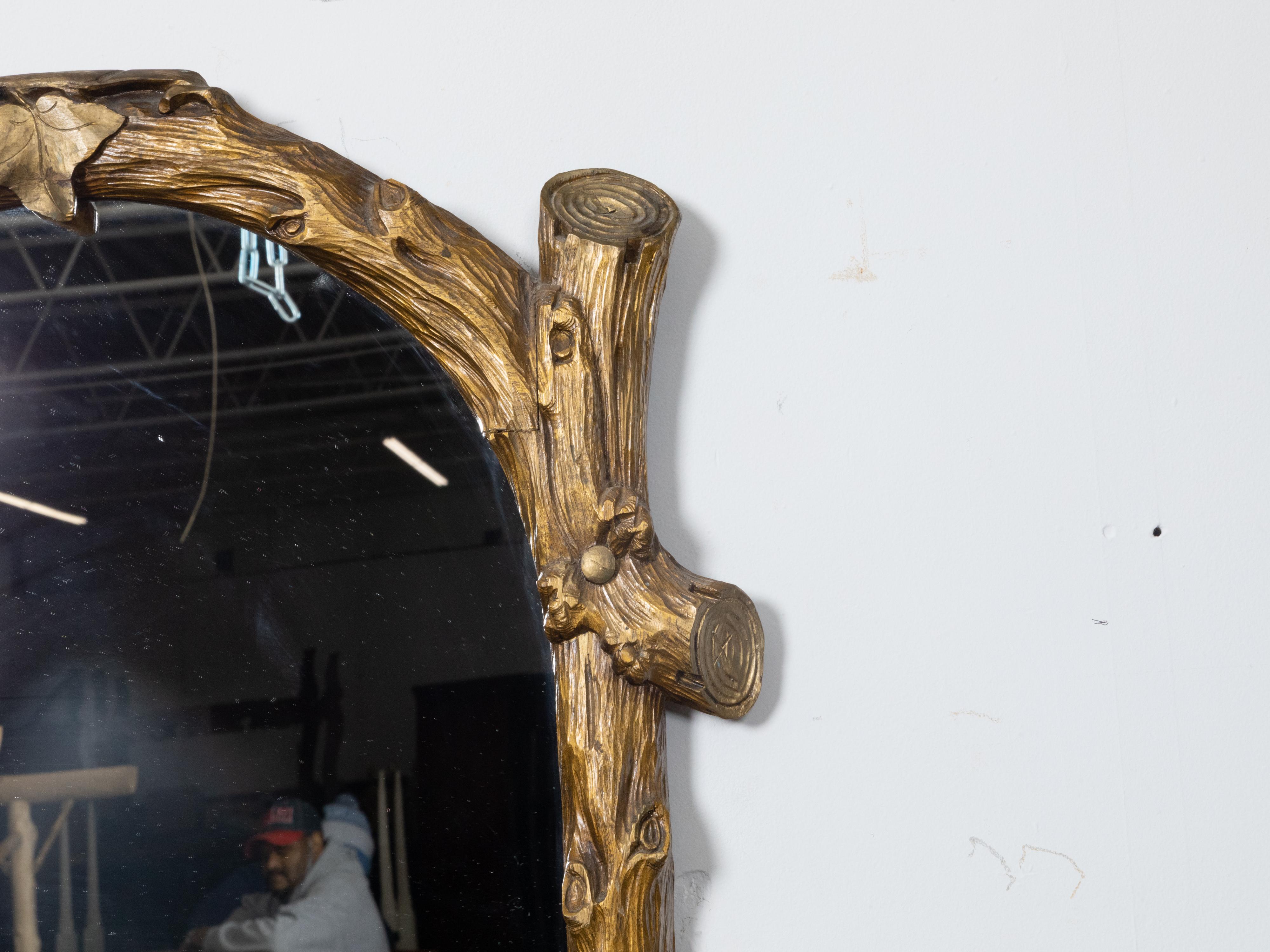 Carved French Black Forest Turn of the Century Giltwood Faux Wooden Mirror, circa 1900