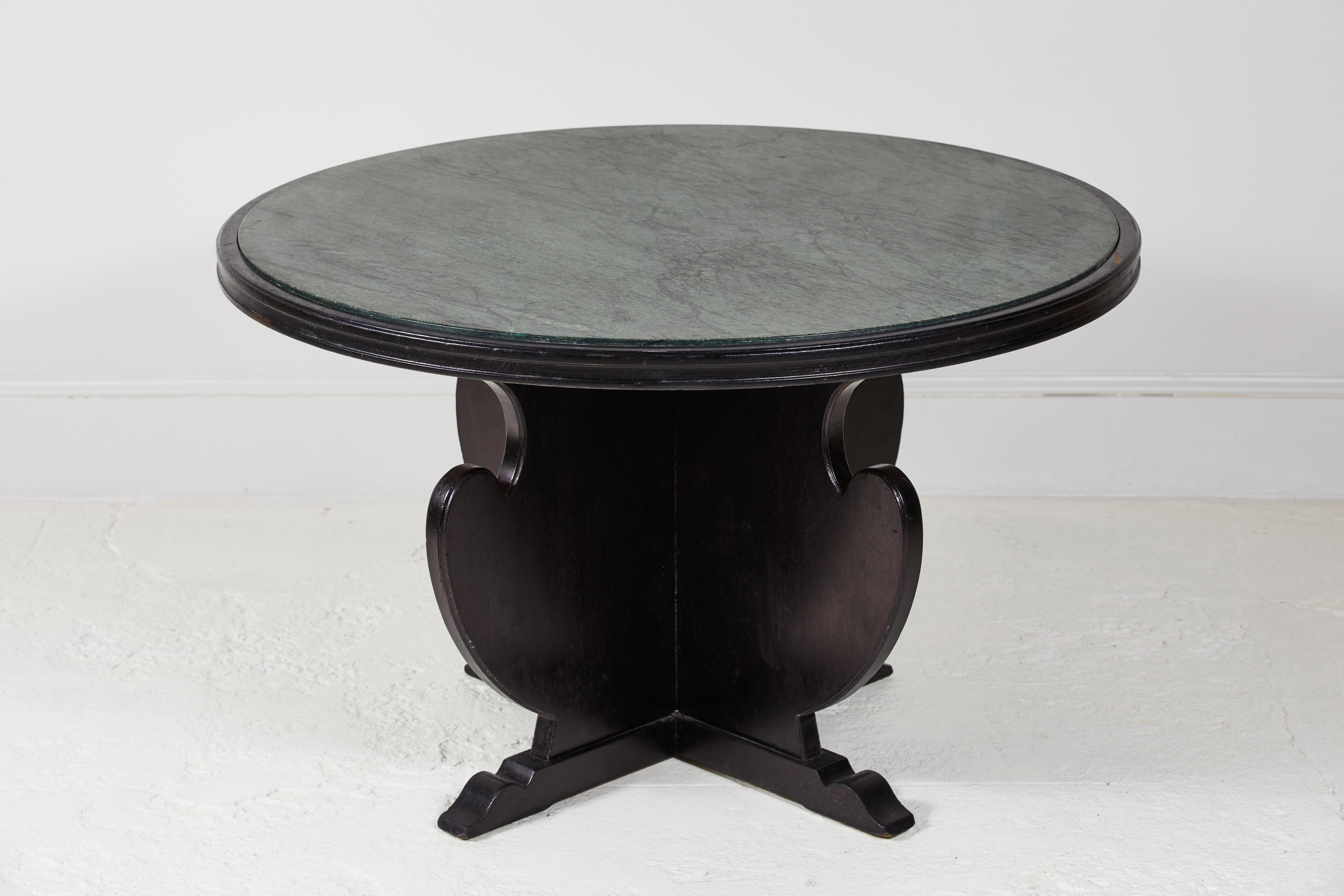 Unique French black game table with scrolled base and green marble inlay.