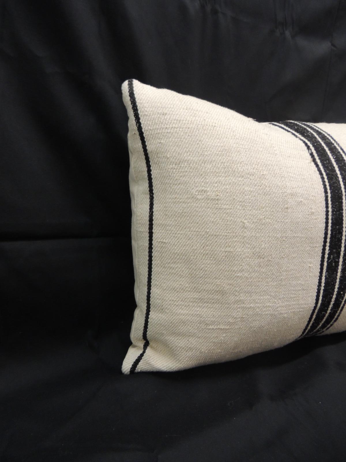 19th century French stripes lumbar decorative pillow in natural and black.
Decorative pillow textile show vertical stripes on tan with a woven homespun textile.
French decorative cushion finalized with natural linen backing. Throw pillow in shades