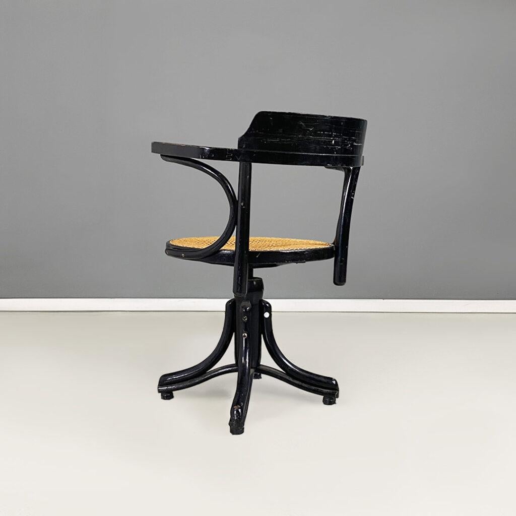 Early 20th Century French black wood and Vienna straw swivel chair in Thonet style, 1900s For Sale