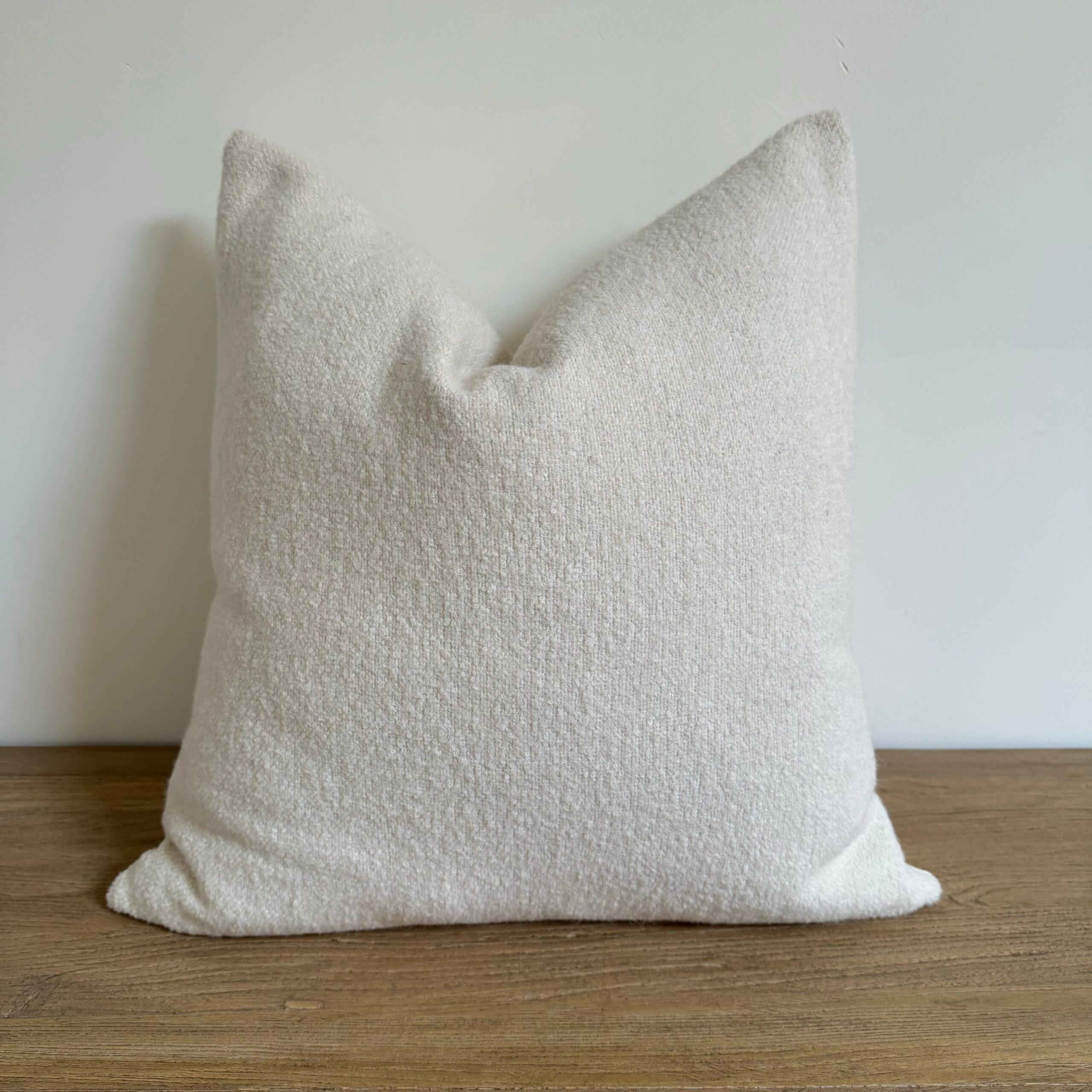 A luxurious heavy woven bouclette wool & linen face with stone washed linen back.
Linen fabric is imported from France.
Custom made to order, can be customized to your size.
Color: Blanc
Antique brass zipper
Size 22x22
Includes Down Feather