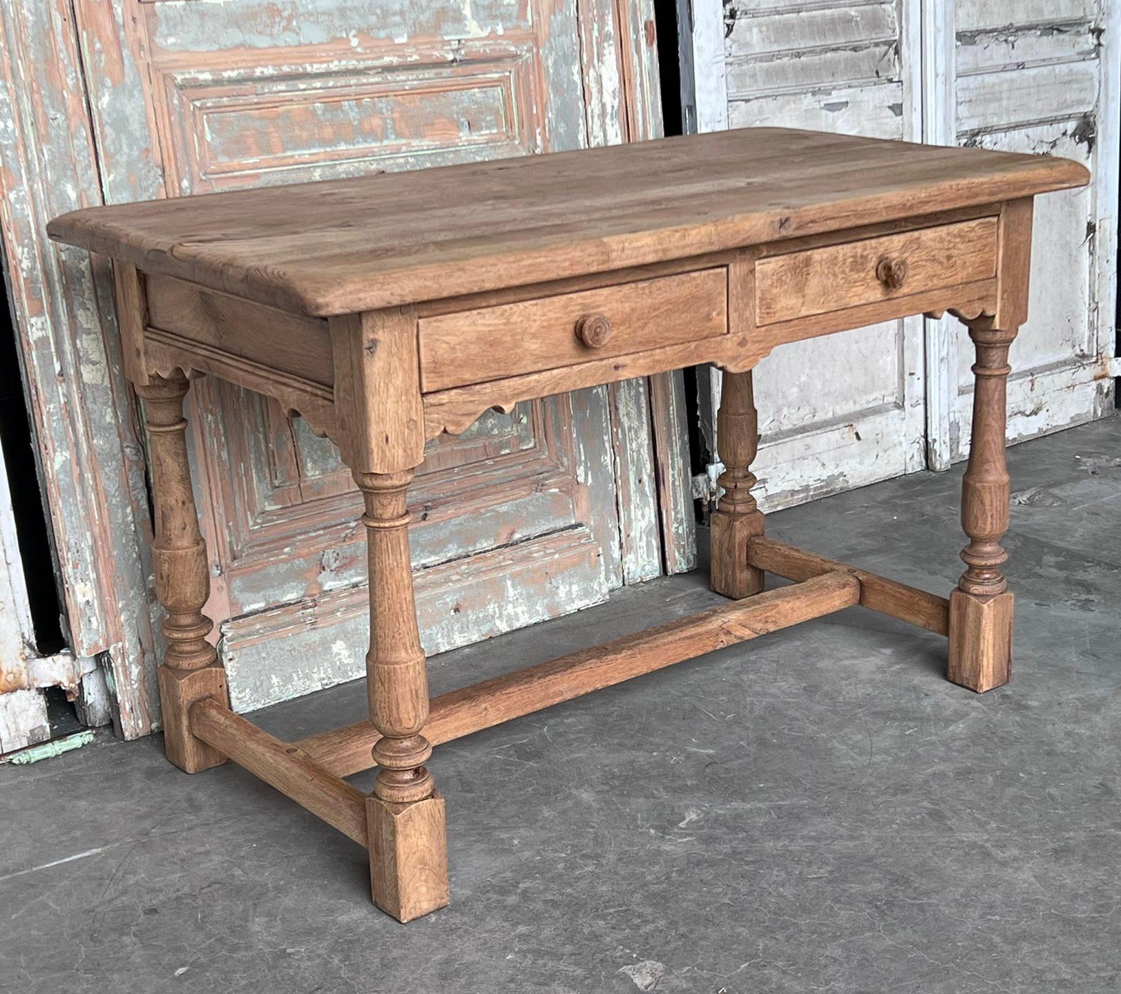 A lovely French bleached Oak 2 drawer side or writing table. The drawers run smoothly but part of one knob is missing otherwise in excellent original condition.
Width 125 cm
Depth 68 cm
Height 78 cm.