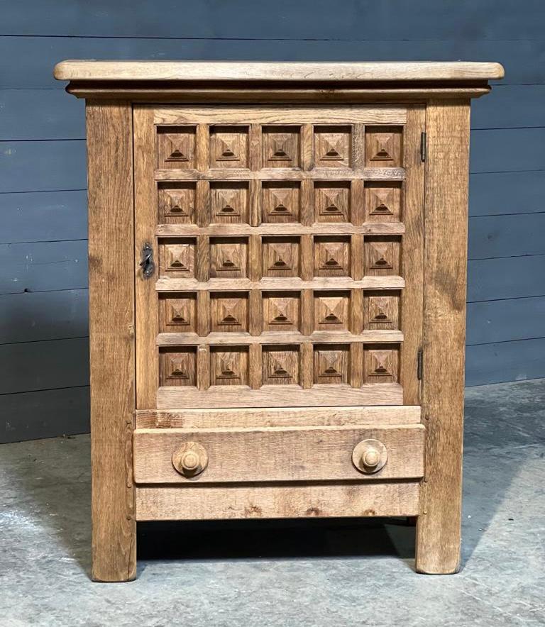 A very good quality and stylish French Oak cupboard. Gothic in style and made from solid Oak in the early 1900s, of excellent quality construction. We have bleached this to lighten and bring out the natural wood. The single door is lockable (key