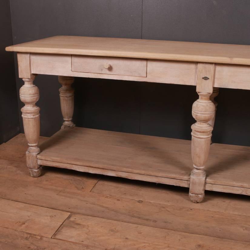 Narrow 19th century French bleached oak drapers table, 1809.

Dimensions
84 inches (213 cms) wide
24.5 inches (62 cms) deep
31.5 inches (80 cms) high.

   