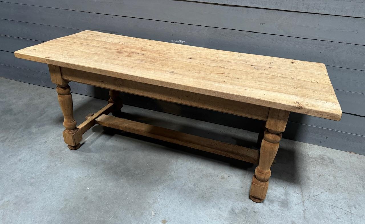 A lovely French Solid Oak Farmhouse Dining Table. We have bleached this for a lighter look and to bring out the natural beauty of the wood. The top comes off for easy access into the home and in overall excellent original condition.
Length 201.5