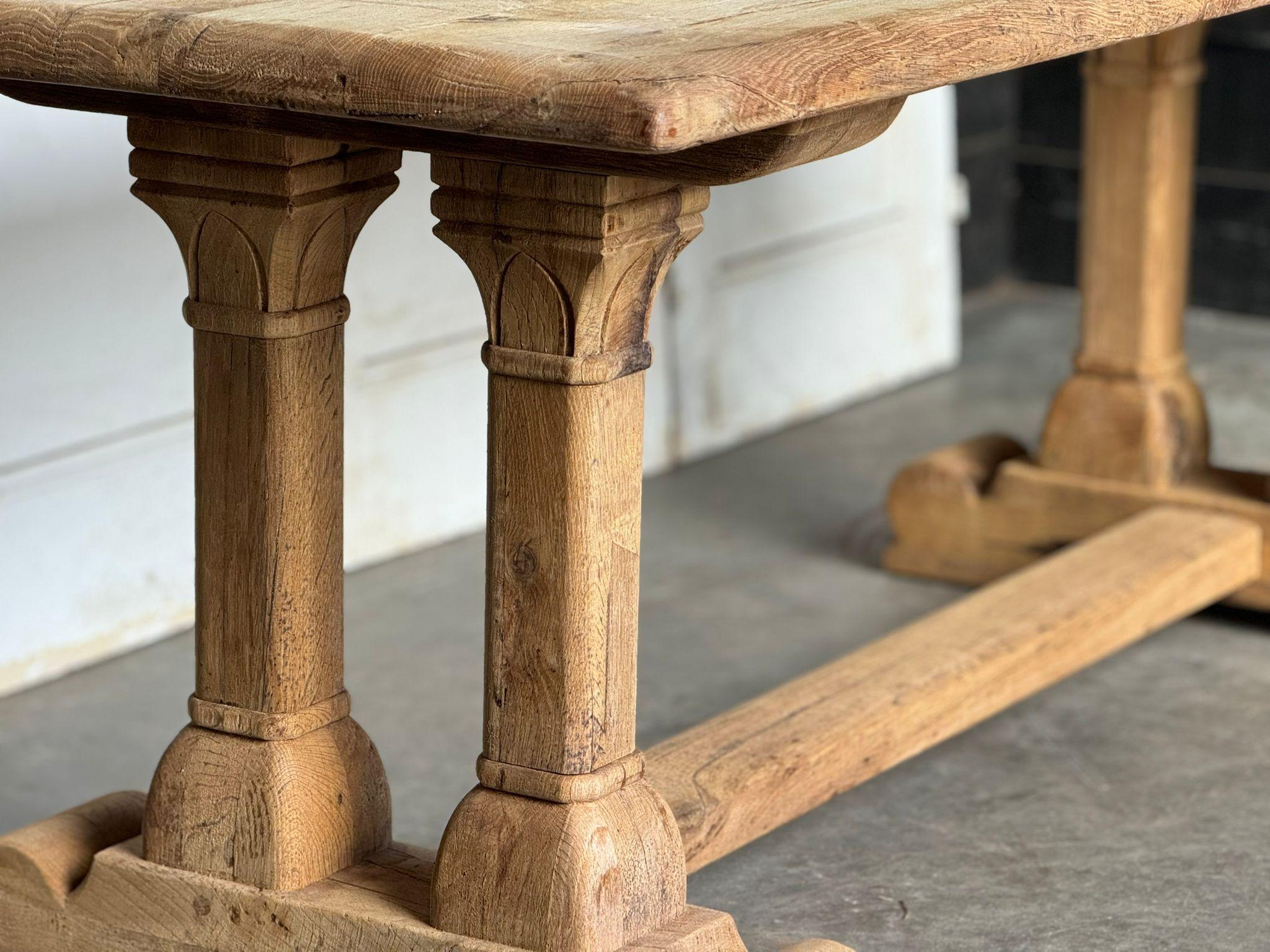 A nice model Solid Oak Farmhouse Dining Table, French in origin and dating to the early 1900s, we love the architectural end supports, of excellent quality construction this table will be around for generations to come. We have bleached it for a