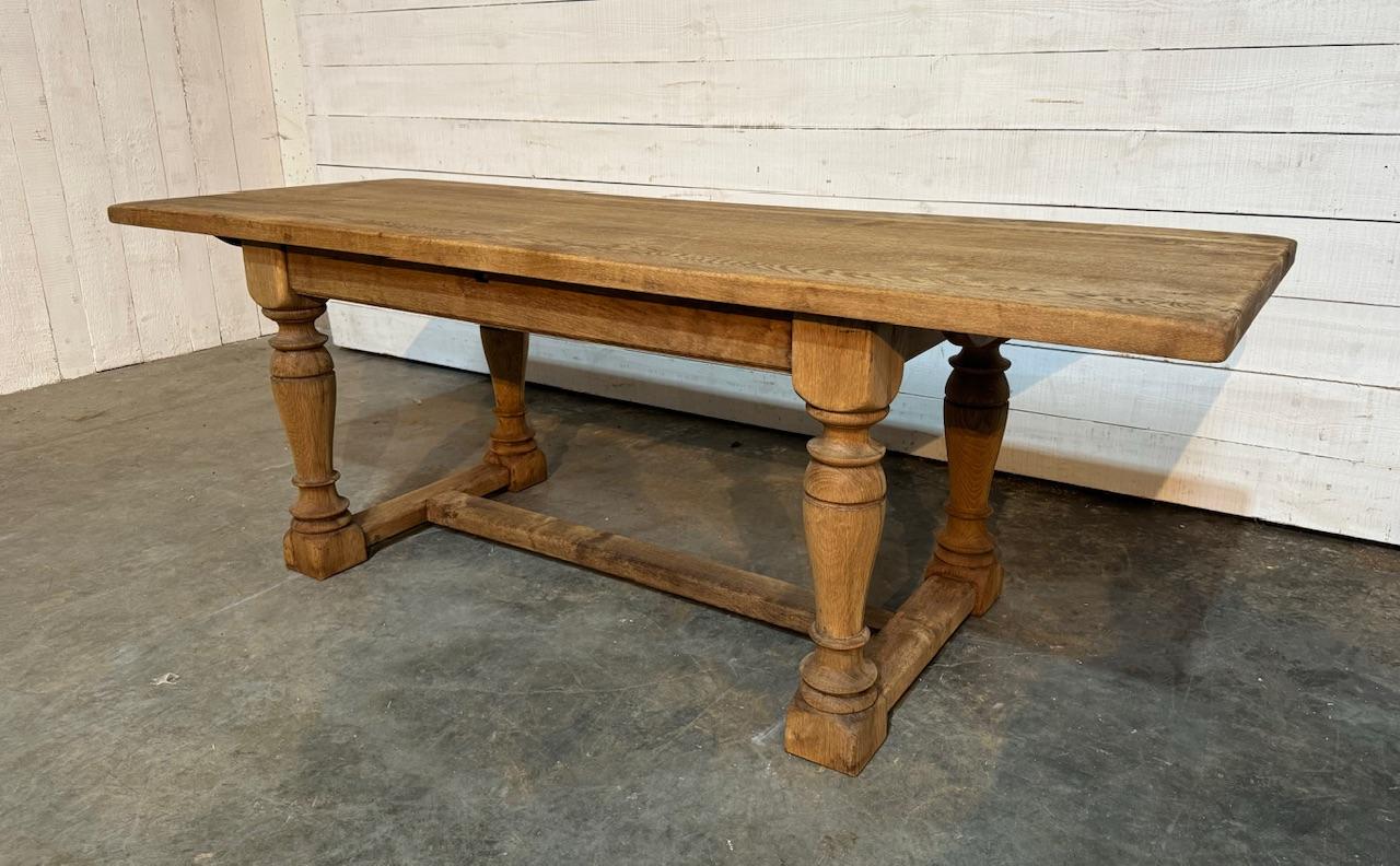 A good quality Solid Oak Farmhouse Dining Table, French in origin and dating to the early 1900s. Good End overhang to sit a chair under and the knee clearance is very good. We have bleached it for a lighter look and to bring out the beauty of the