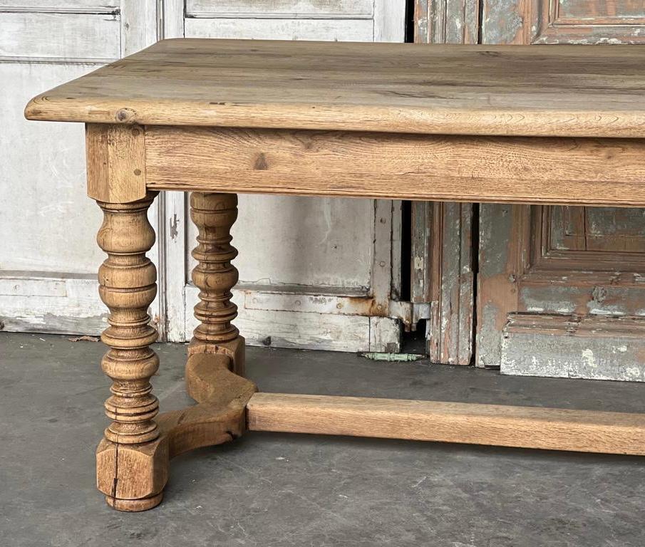 A great looking French Oak Farmhouse kitchen dining table having a large drawer in each end. Made from solid Oak in the early 1900s and of good quality construction. Lots of character especially the top. We have bleached it for a lighter look and to