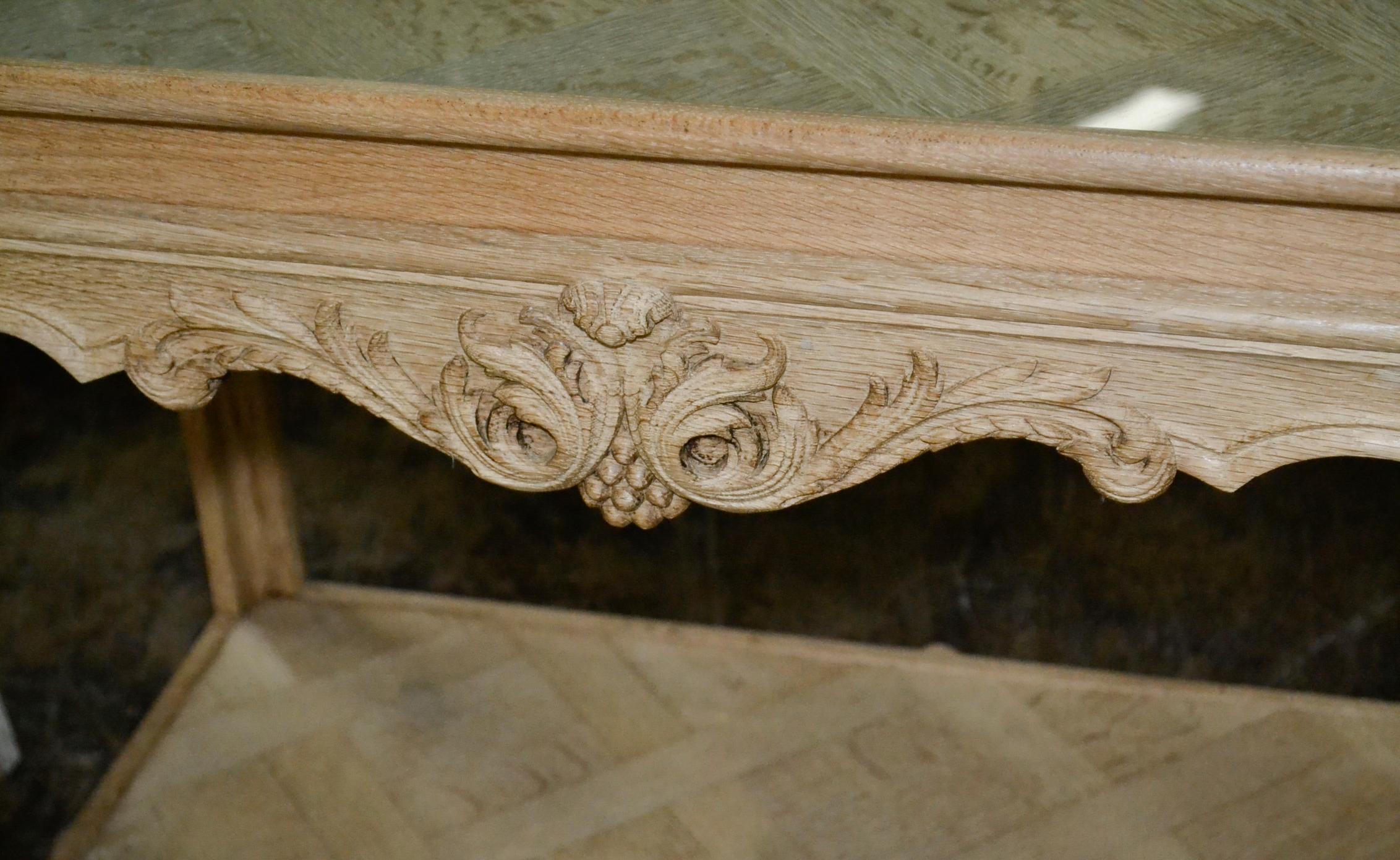 Delightful French carved and bleached white oak occasional table.