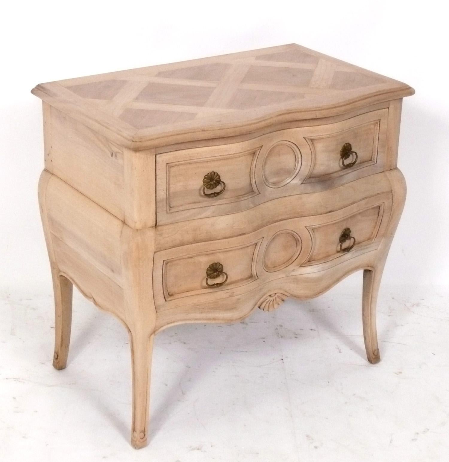 Elegant French bleached oak parquet nightstand or end table, France, circa 1950s. It is a versatile size and can be used as a nightstand, or as an end or side table. 