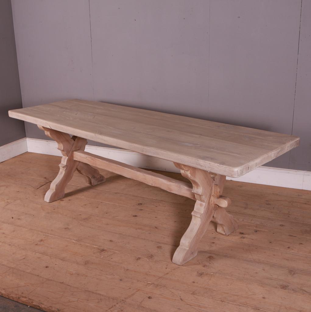 Late 19th C French bleached oak trestle table. 1890.

The table top is 2
