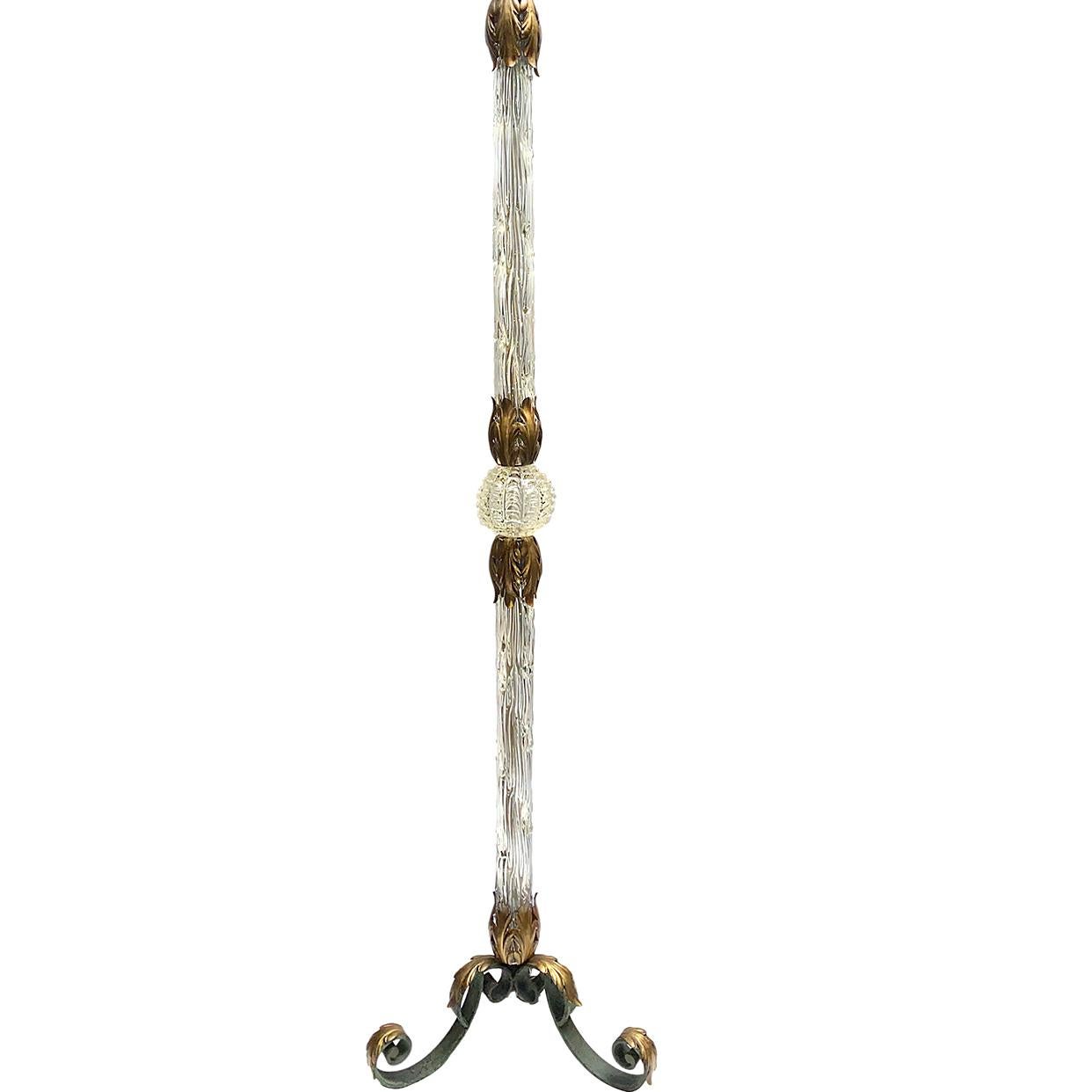 A circa 1950's French blown glass and gilt metal floor lamp with wrought iron base. 

Measurements:
Height of body: 66