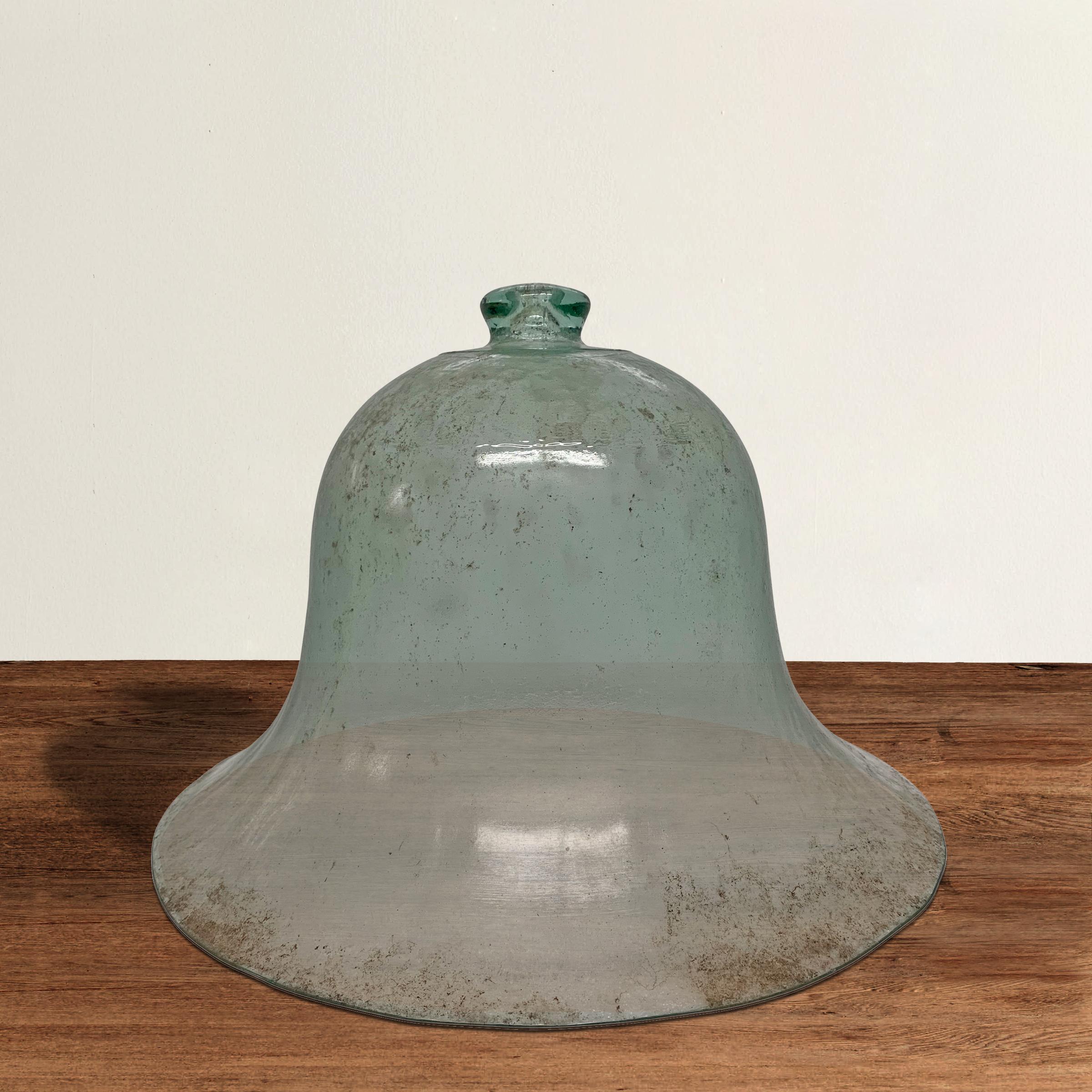 A wonderful bell-shape early 20th century French blown-glass garden cloche used to cover young plants to stimulate growth. Wonderful blue-green color!
