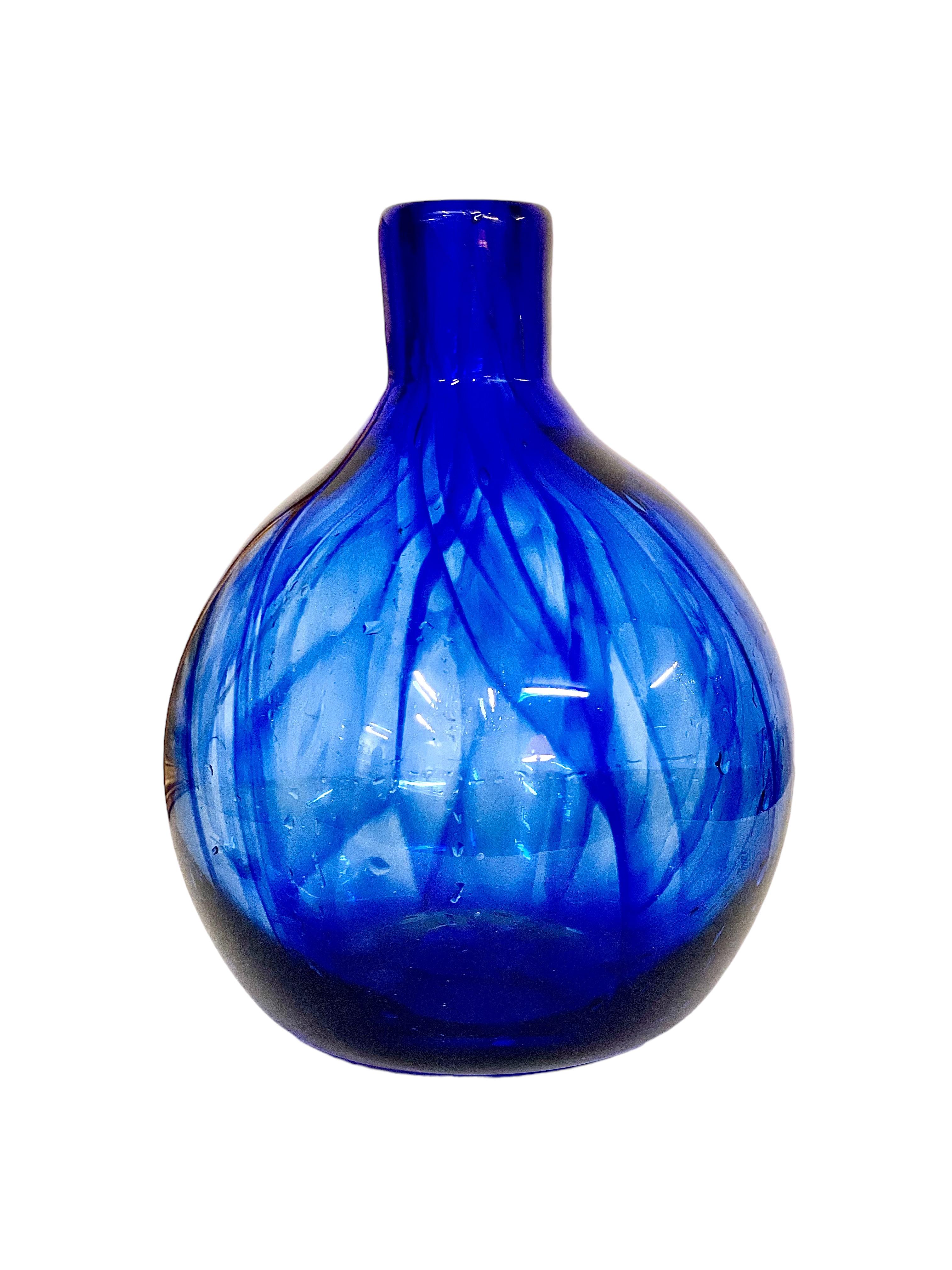 This vintage French mouth-blown glass vase or bottle in vivid blue was made by world-renowned French glassblower Jean Claude Novaro, who was born in Antibes in 1943. Crafted in a wonderfully tactile 'onion' shape, this decorative bottle with its