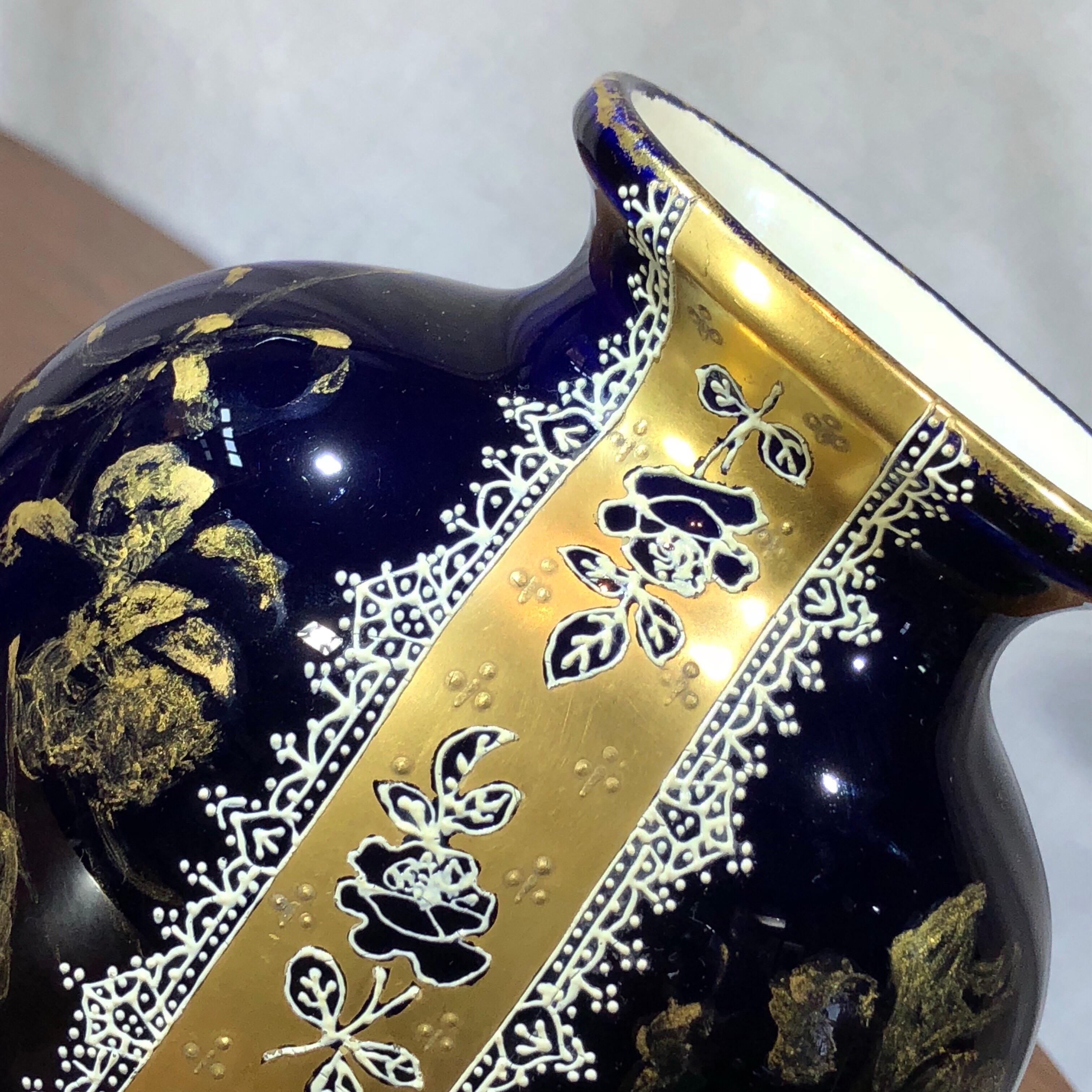French Choisy Le Roi pottery vase with hand gilded flowers and a central ribbon of gilt with white lace border in enamel on a deep blue ground.
HBC mark “Choisy-le-Roi DECOR No 3' to base, Impressed 1037,
circa 1880.