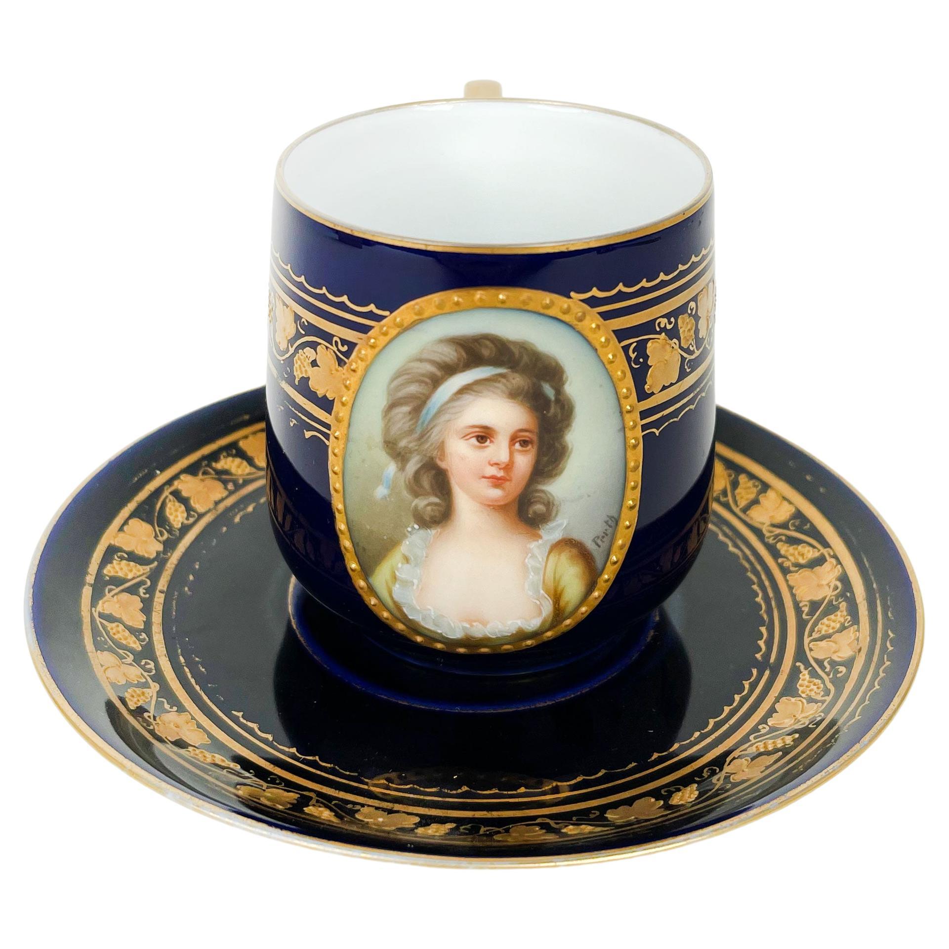 French Blue Cobalt Ground Hand Painted Porcelain Cup & Saucer For Sale