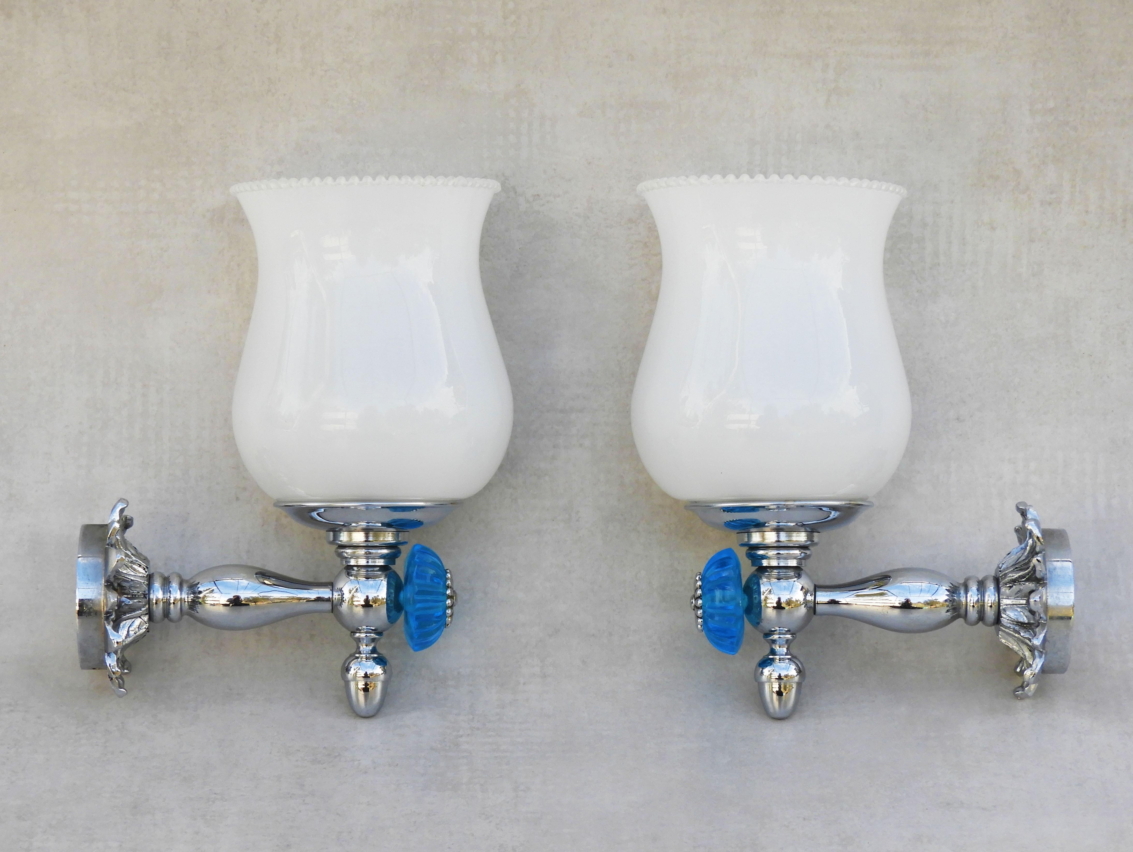 A beautiful pair of sconces from France C1960. Charming French wall lights in chrome and opaline featuring blue-faceted glass, foliage and daisy flower detailing. Well-made, good-quality lights, perfect for either side of a vanity mirror in a