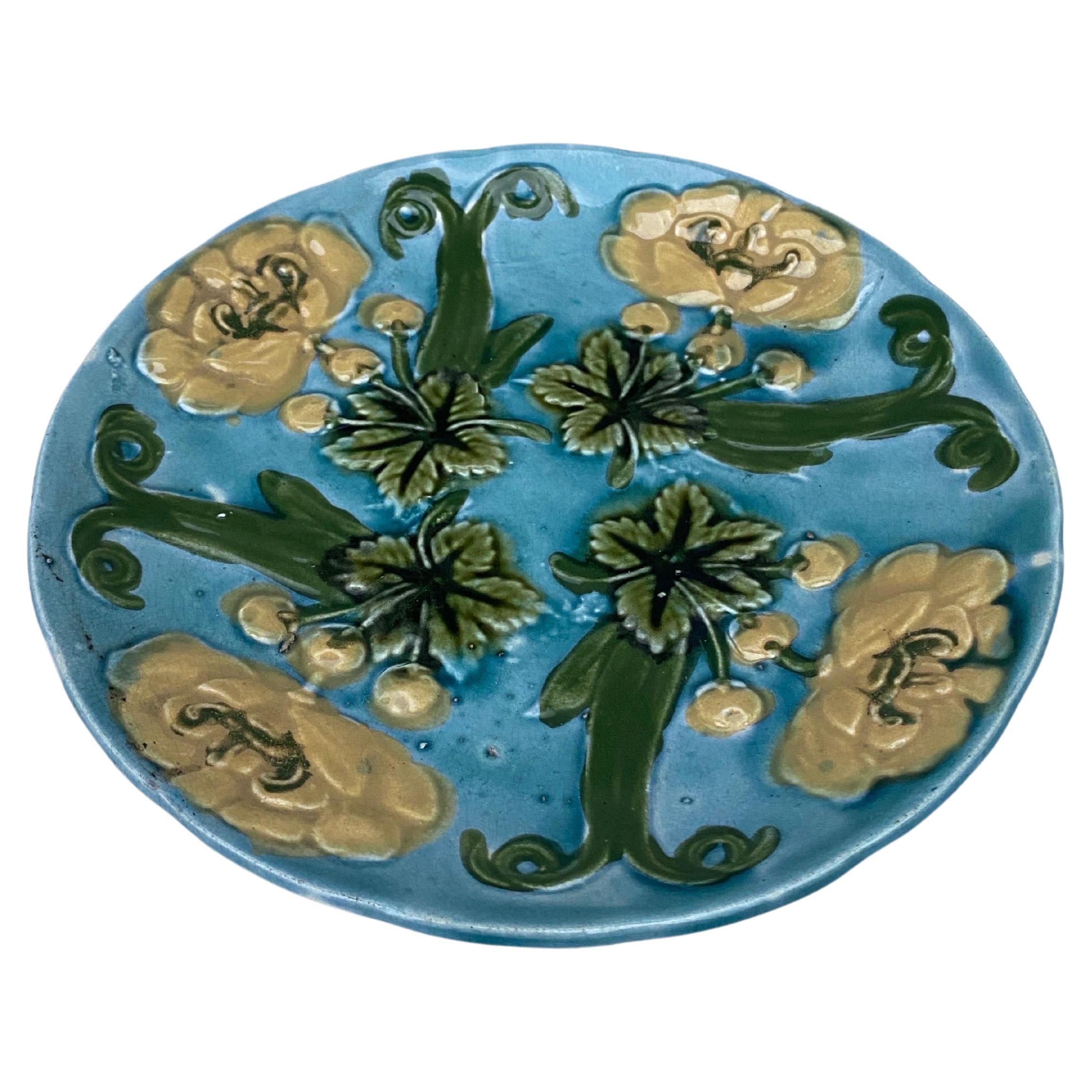 French Blue Majolica Plate with Yellow Flowers Circa 1890.