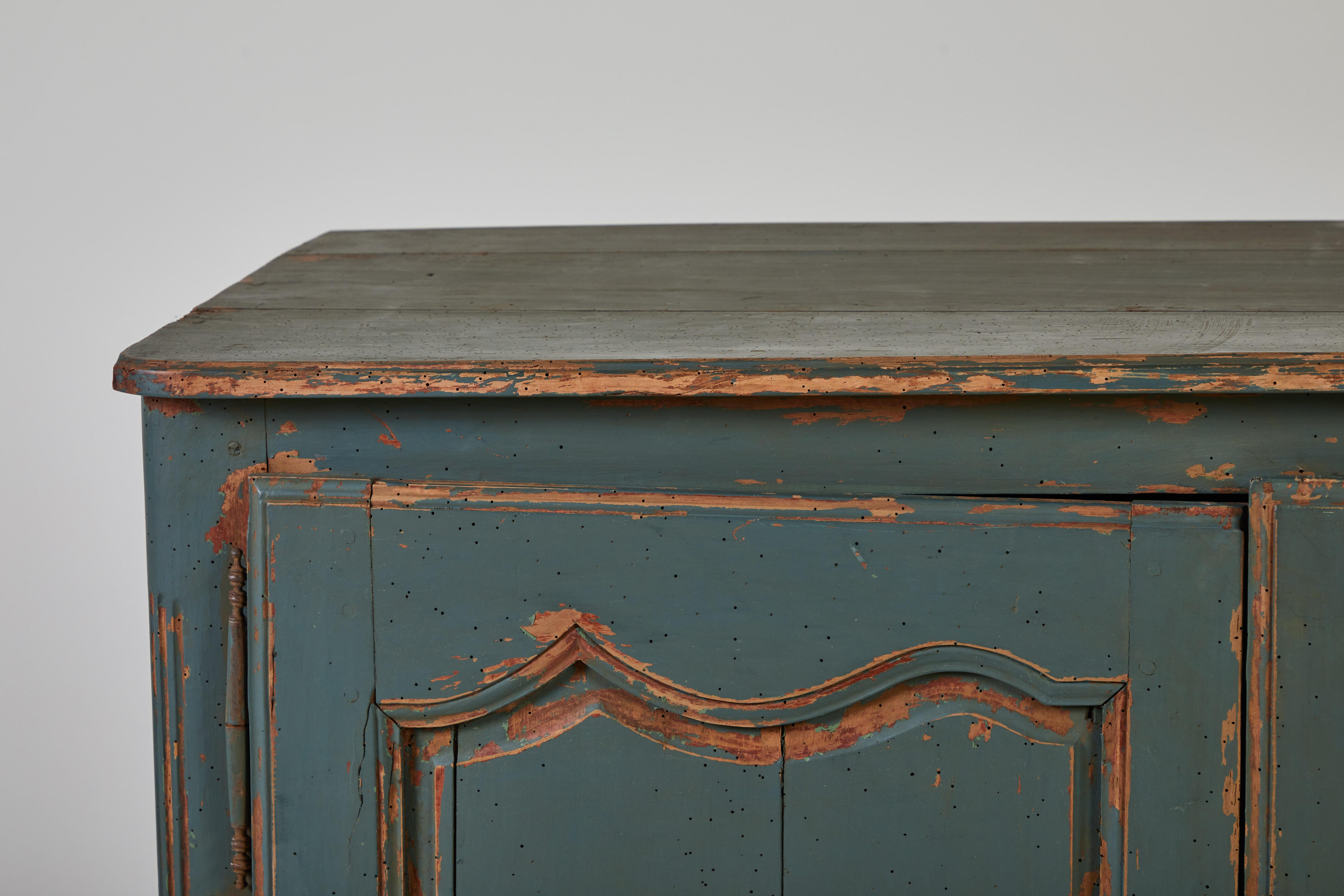 French cabinet with original blue paint, scrolled details add a bit of charm and whimsy.

 