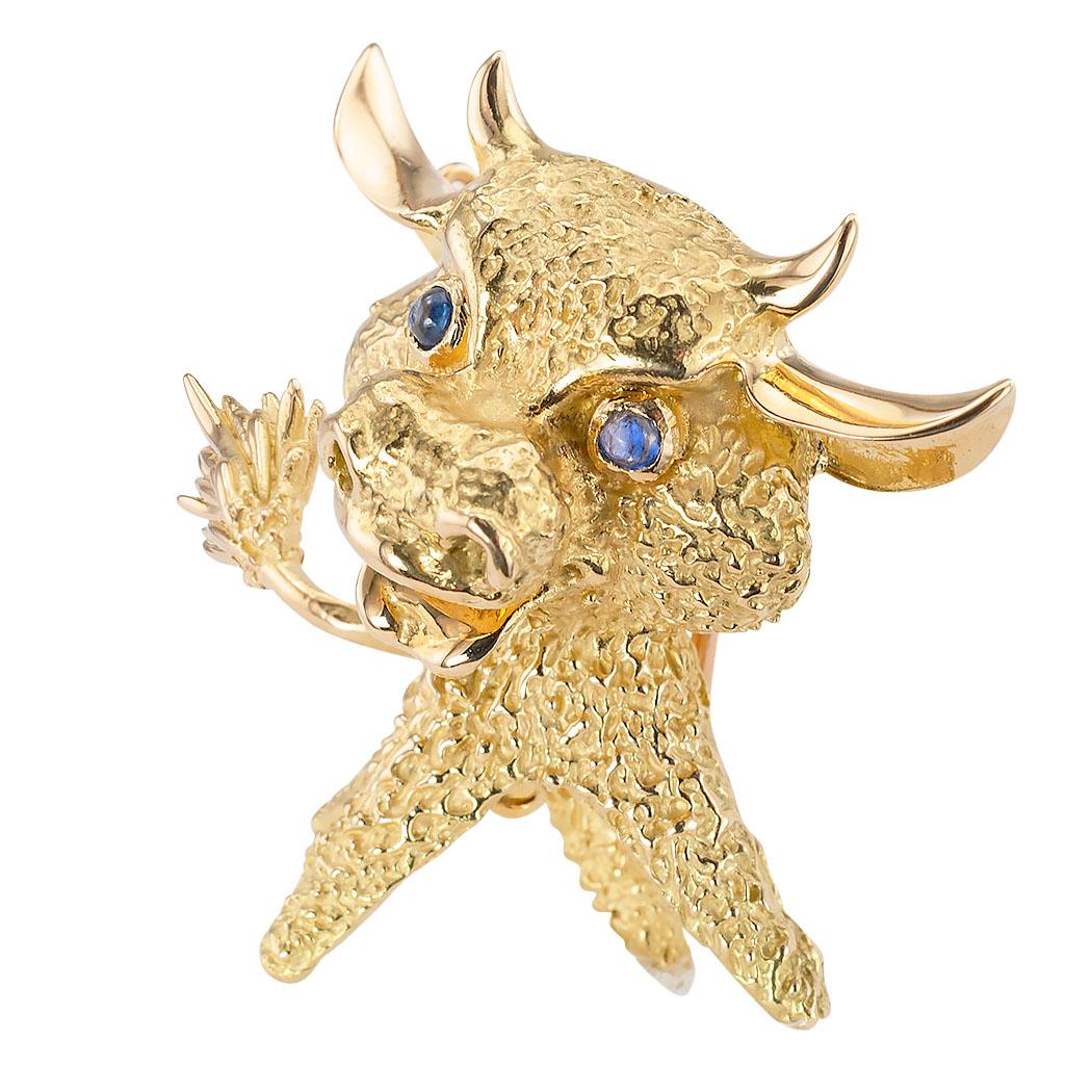 Vintage French blue sapphire set eyes and 18 karat yellow gold whimsical bull clip brooch circa 1970.  Love it because it caught your eye and we are here to connect you with beautiful and affordable jewelry.  Make yourself happy!  Simple and concise