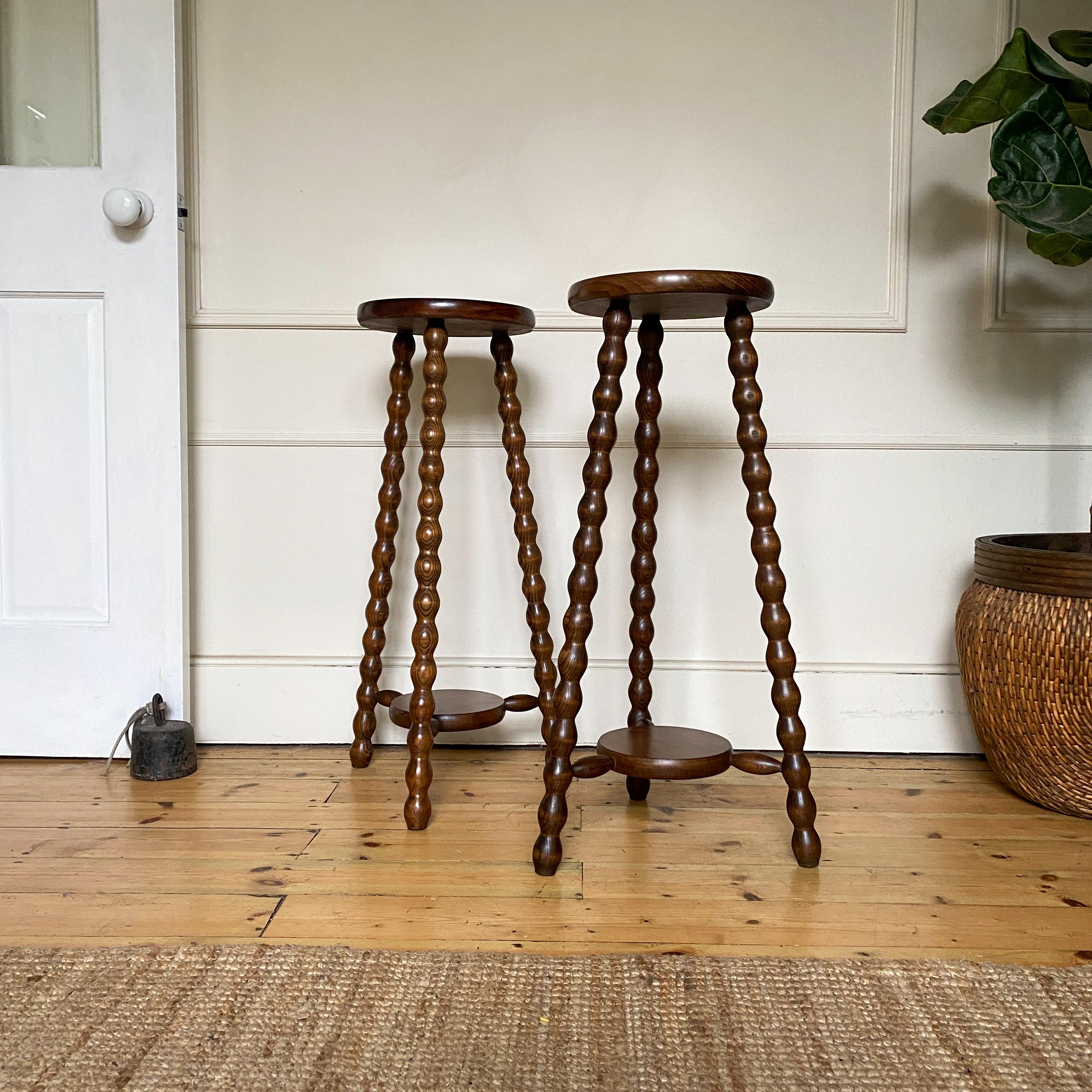 Price for the pair - available singularly also. Enhance your decor with these elegant French Bobbin Side Tables, perfect as plant stands or accent pieces. The intricate bobbin design adds a touch of vintage charm, making them a stylish addition to