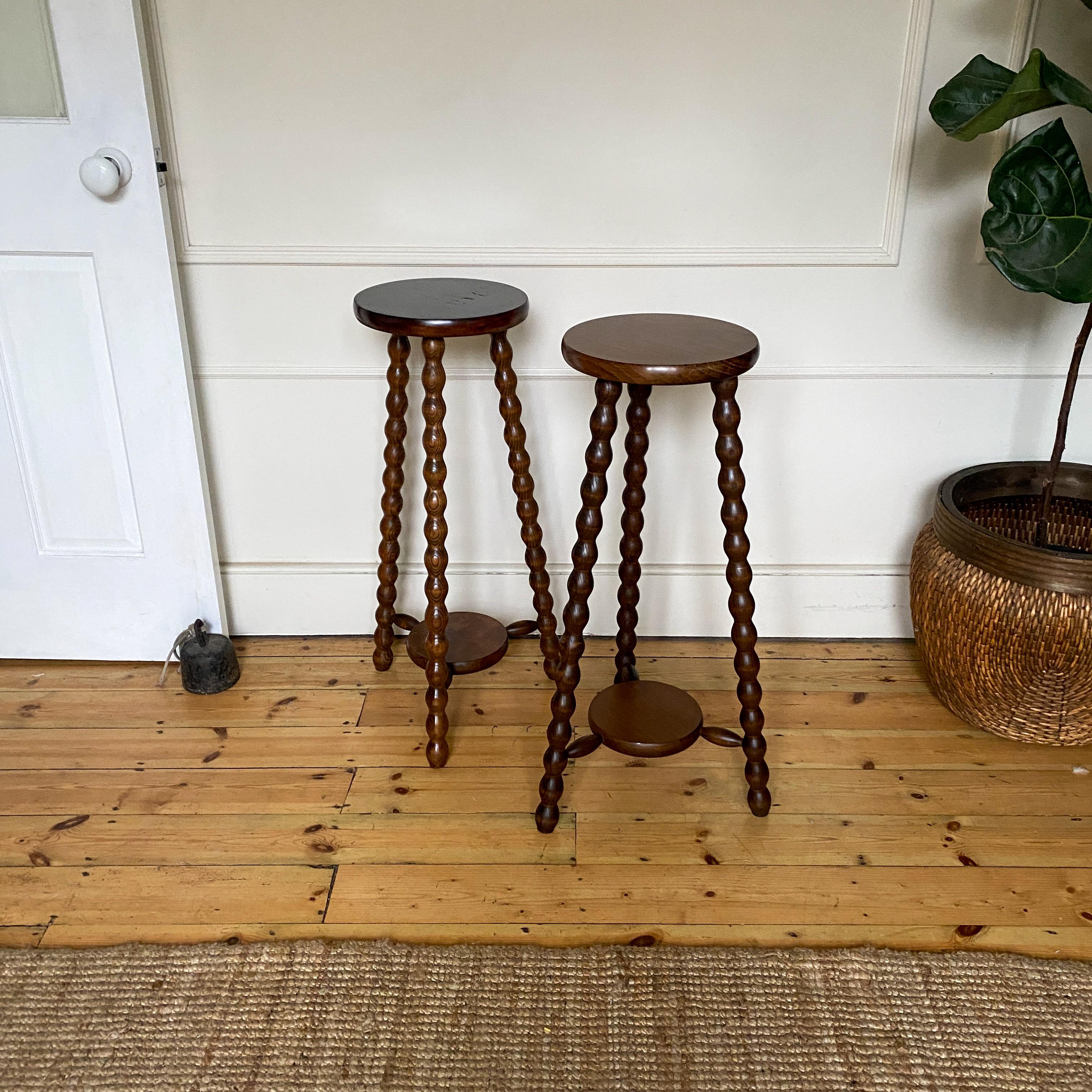 Enhance your decor with these elegant French Bobbin Side Tables, perfect as plant stands or accent pieces. The intricate bobbin design adds a touch of vintage charm, making them a stylish addition to any room. Versatile and chic, these tables are