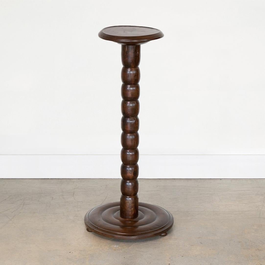 Great dark ebony wood pedestal table with beautiful bobbin style stem from France, 1940's. Circular tiered base and circular top with ribbed detailing on edge. Newly re-finished. Top measures 10