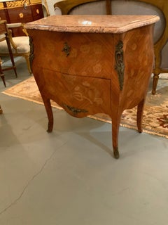 French Bombe shaped antique commode with marquetry