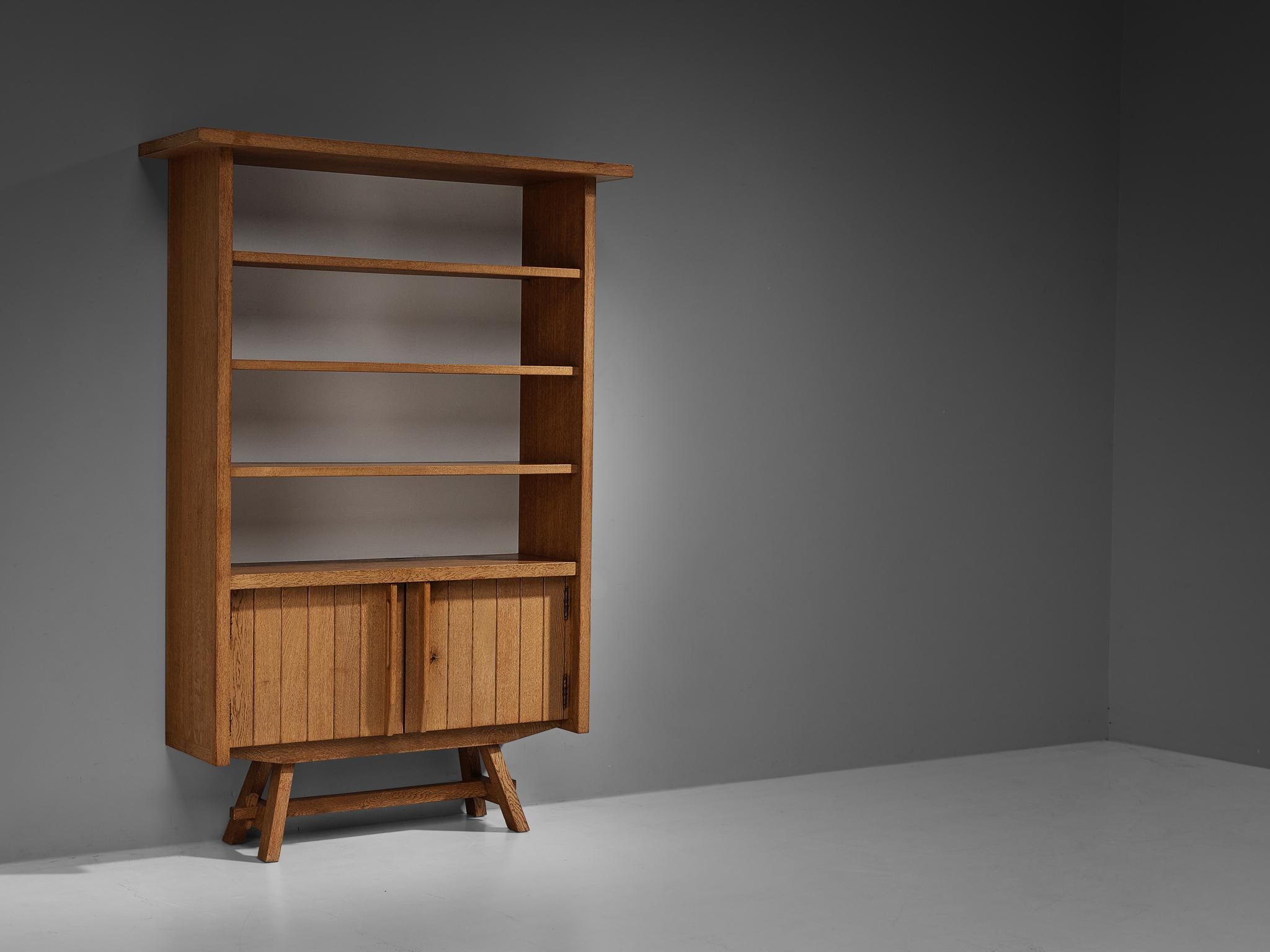 Cupboard, oak, metal, lacquered wood, France, 1960s.

This piece of furniture can be used for various occasions. You can use it as a vitrine to showcase your valued belongings, such as books, glassware, and artistic objects. Or the cabinet can serve