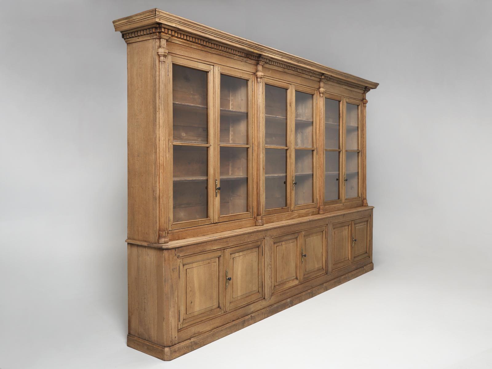 Massive and completely original, unrestored French antique weathered Oak Bookcase, dating from the mid-1800’s. This highly unique antique French Bookcase, might have the most beautiful color oak we have ever seen. This is not some finishers