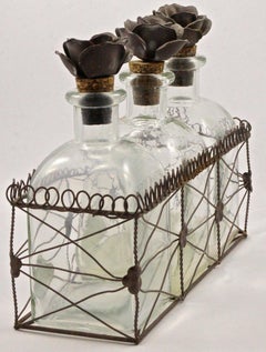 French Bottles with Flower Cork Stoppers in a Wire Basket Holder, circa 1950s