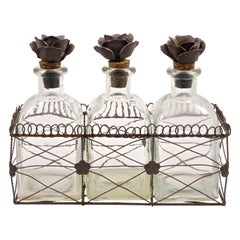 French Bottles with Flower Cork Stoppers in a Wire Basket Holder circa 1950s