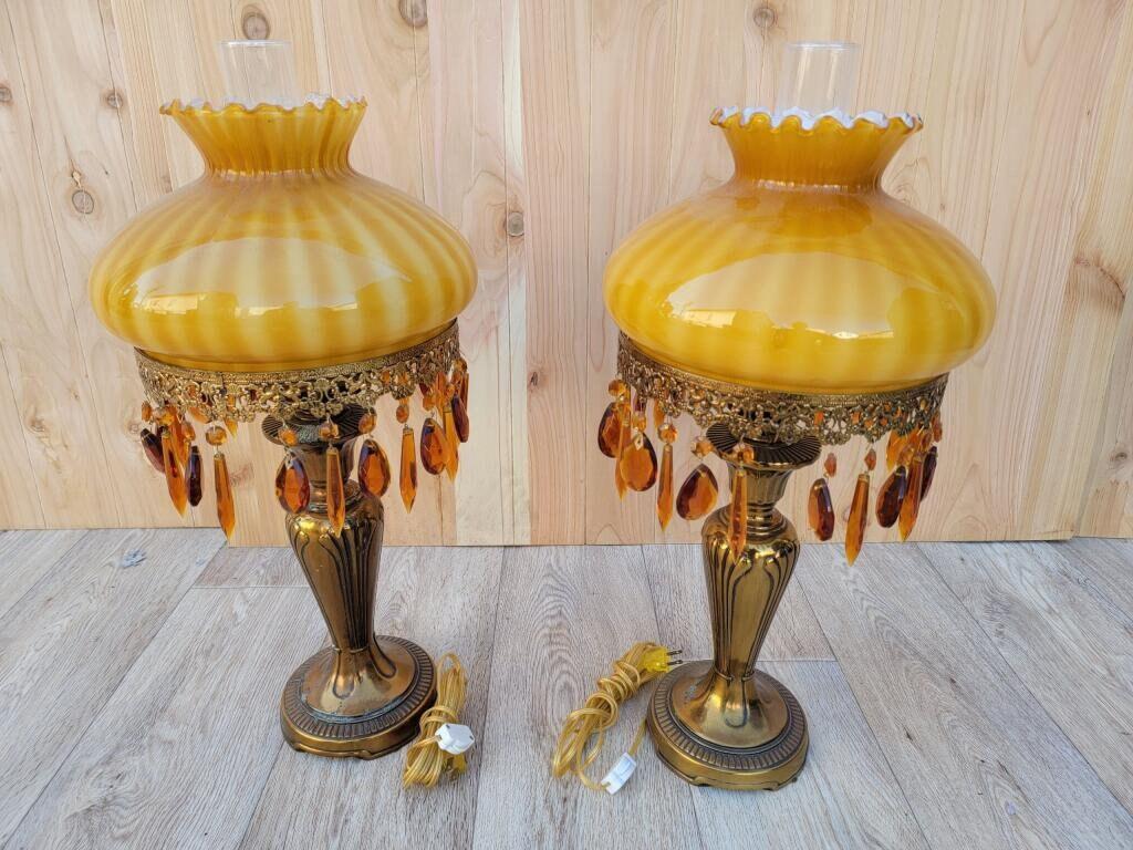 Vintage French Boudoir Style Electric Amber Glass Shade with a Brass Base Oil Lamps - Pair

Gorgeous pair of antique ornate brass-based electric with amber blown glass shades and old Hollywood glam amber prism hanging crystals. These table lamps are
