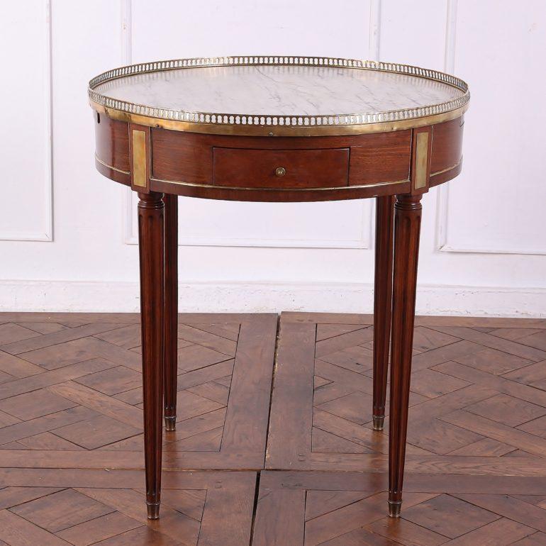 French Bouillotte games table with drawers and pull-out playing surfaces. Lovely contrasting Carrara marble top with brass gallery.



    