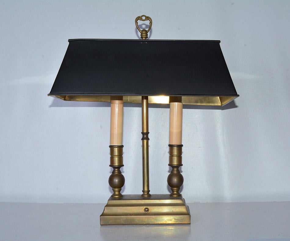 Vintage Empire style bronze table lamp with black tin metal lamp shade with a wonderful aged look. The lamp features a bronze base with two candle light sockets. Lamp measures 19.5 x 16.5 x 6 inches. Lamp shade: D 9.50