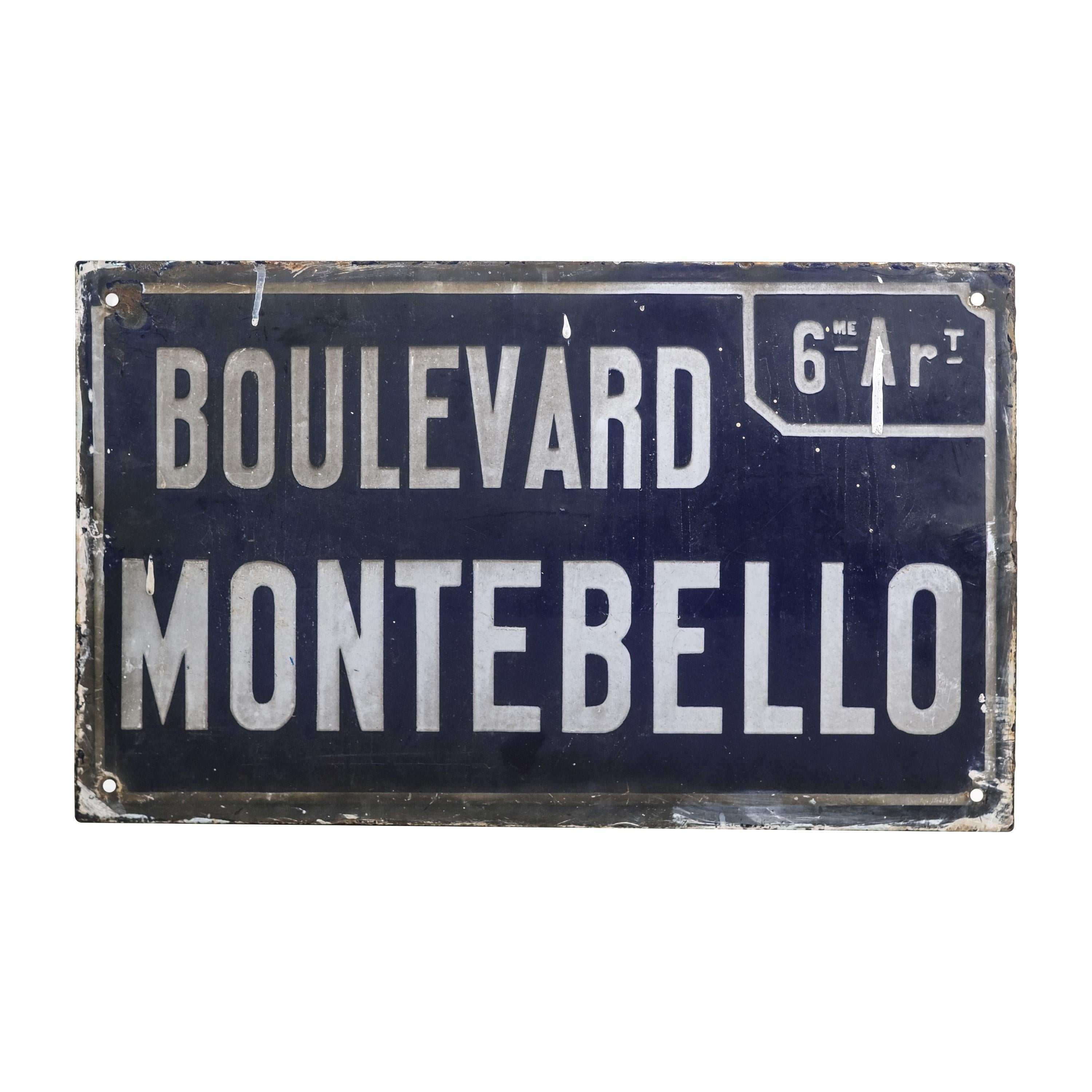 20th century Industrial French steel street or road sign manufactured out of enameled steel. Features dark blue background coloring with white lettering saying Boulevard Montebello. Please note, this item is located in our Scranton, PA location.