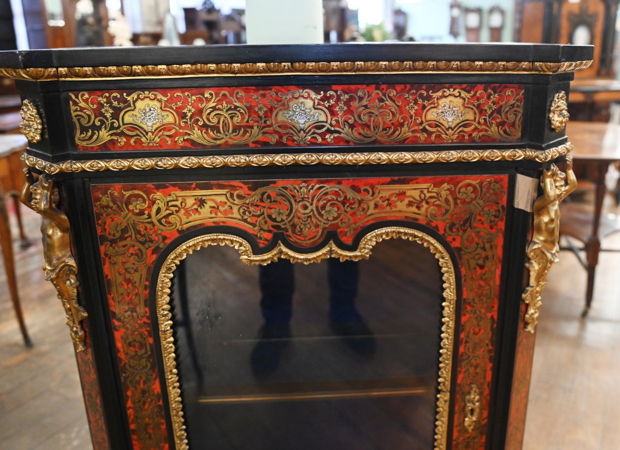 Fine quality French Boulle style pier or side cabinet
Ormulo mounts including intricate cherubim caryatid mounts to the side and grotesque masks
Features classic Boulle style inlay with faux tortoiseshell, brass and ebony
Such a rich, refined look