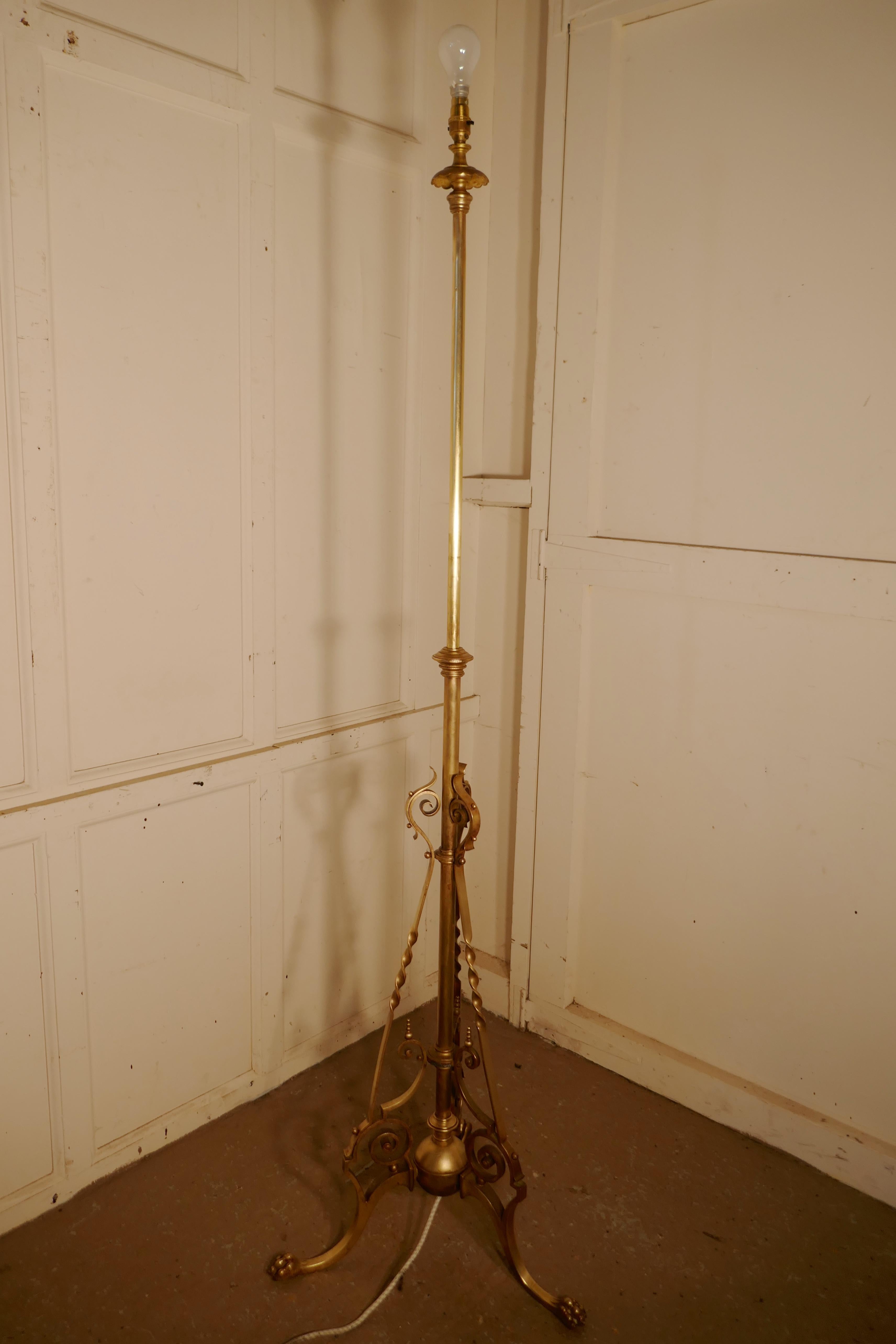 French brass adjustable floor lamp Rococo standard lamp.

This is a very attractive piece, the lamp has a telescopic action and a decorative wrought brass base and a the upright can be extended to raise the height of the lamp
I have shown the