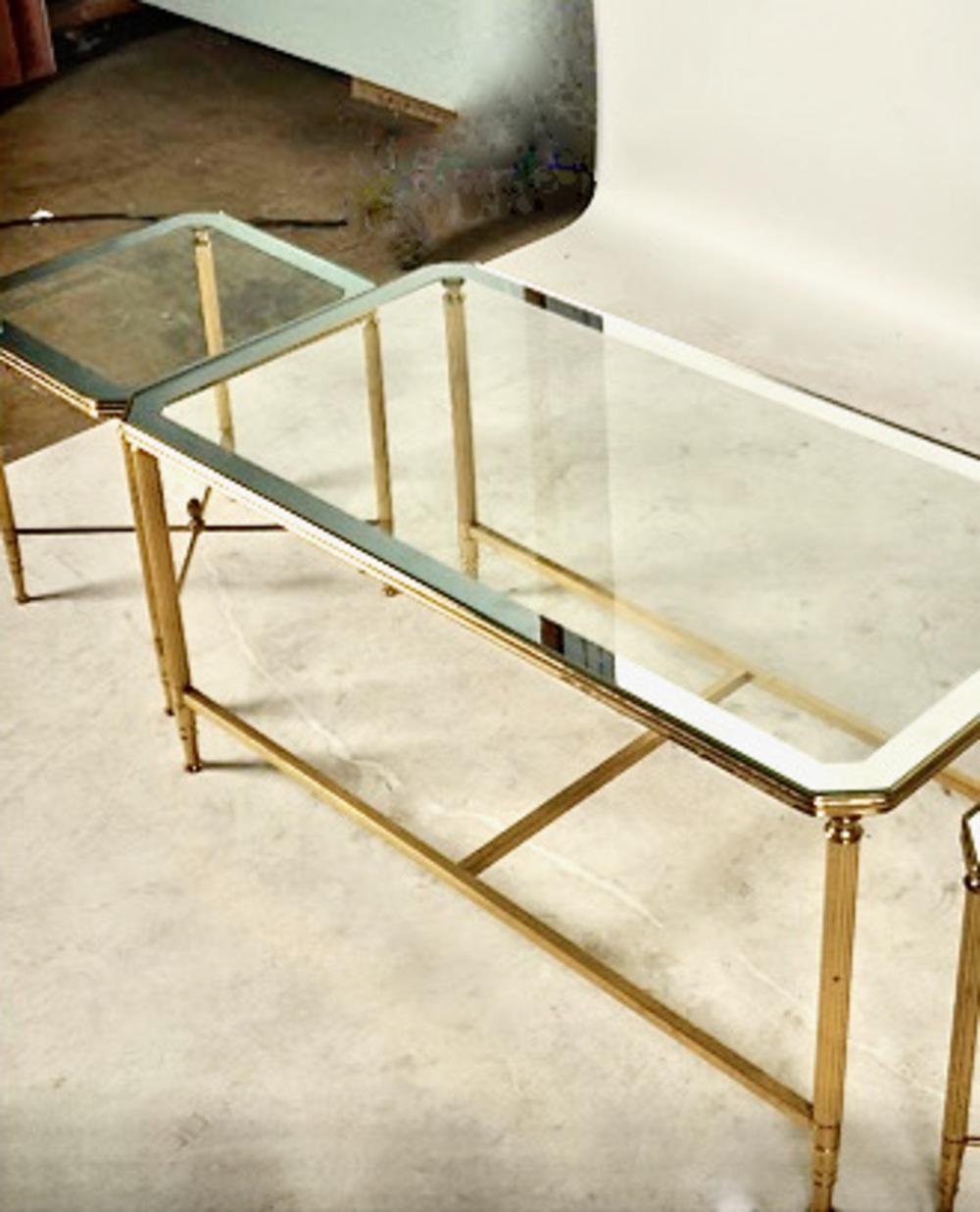 This is a beautifully fabricated 3-part gilt bronze or brass coffee table. The main section of the table measures 18.5