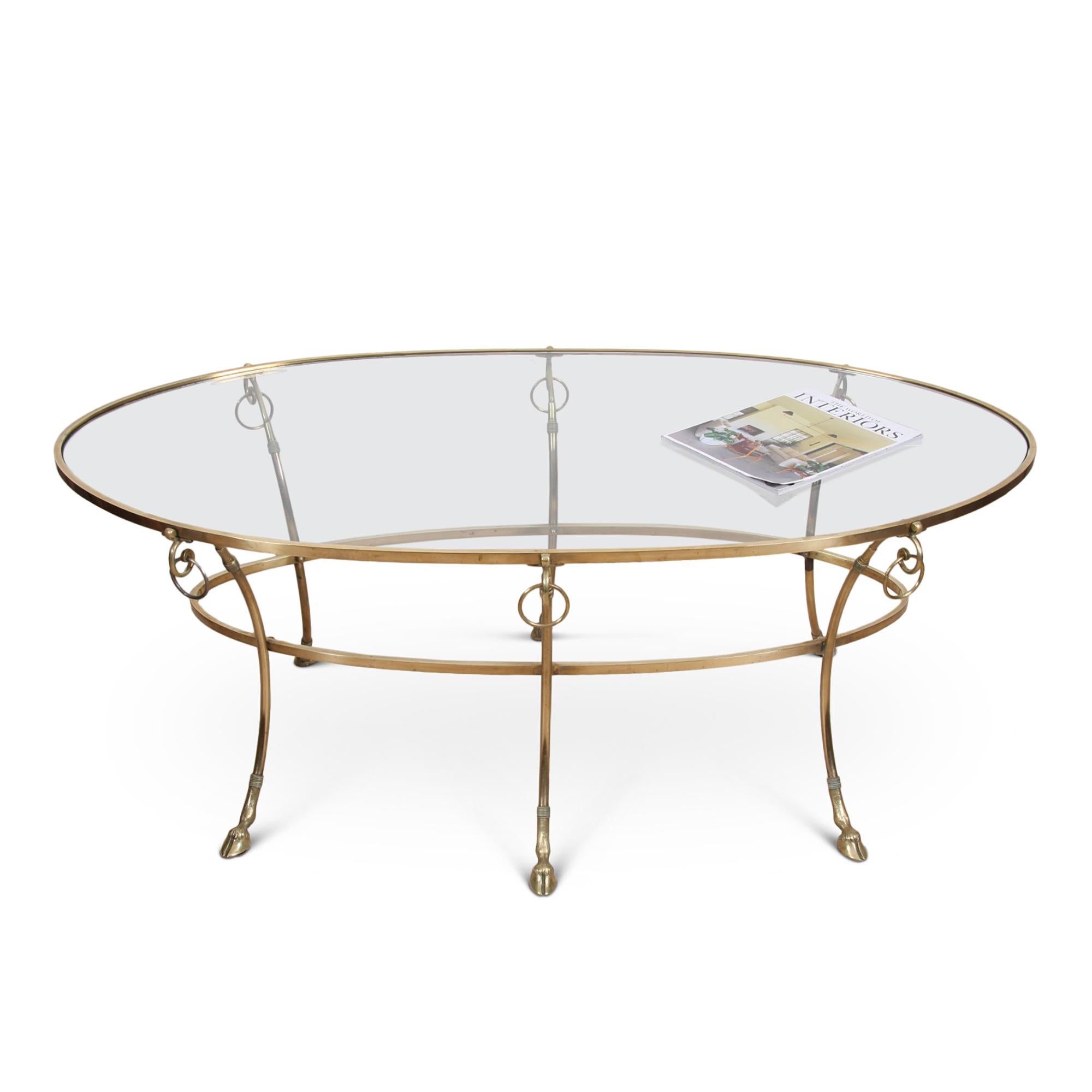 A charming Maison Baguès-style coffee table with hoof feet. This chic oval-shaped table originates from 1960s, France.