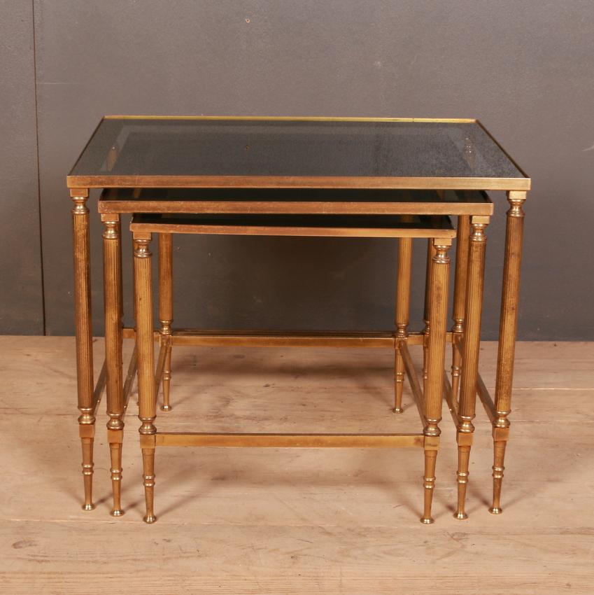 Nest of 1950s French Hollywood revival brass and glass tables. Dimensions are of the largest table.

Dimensions:
20.5 inches (52 cms) wide
14.5 inches (37 cms) deep
17 inches (43 cms) high.

 