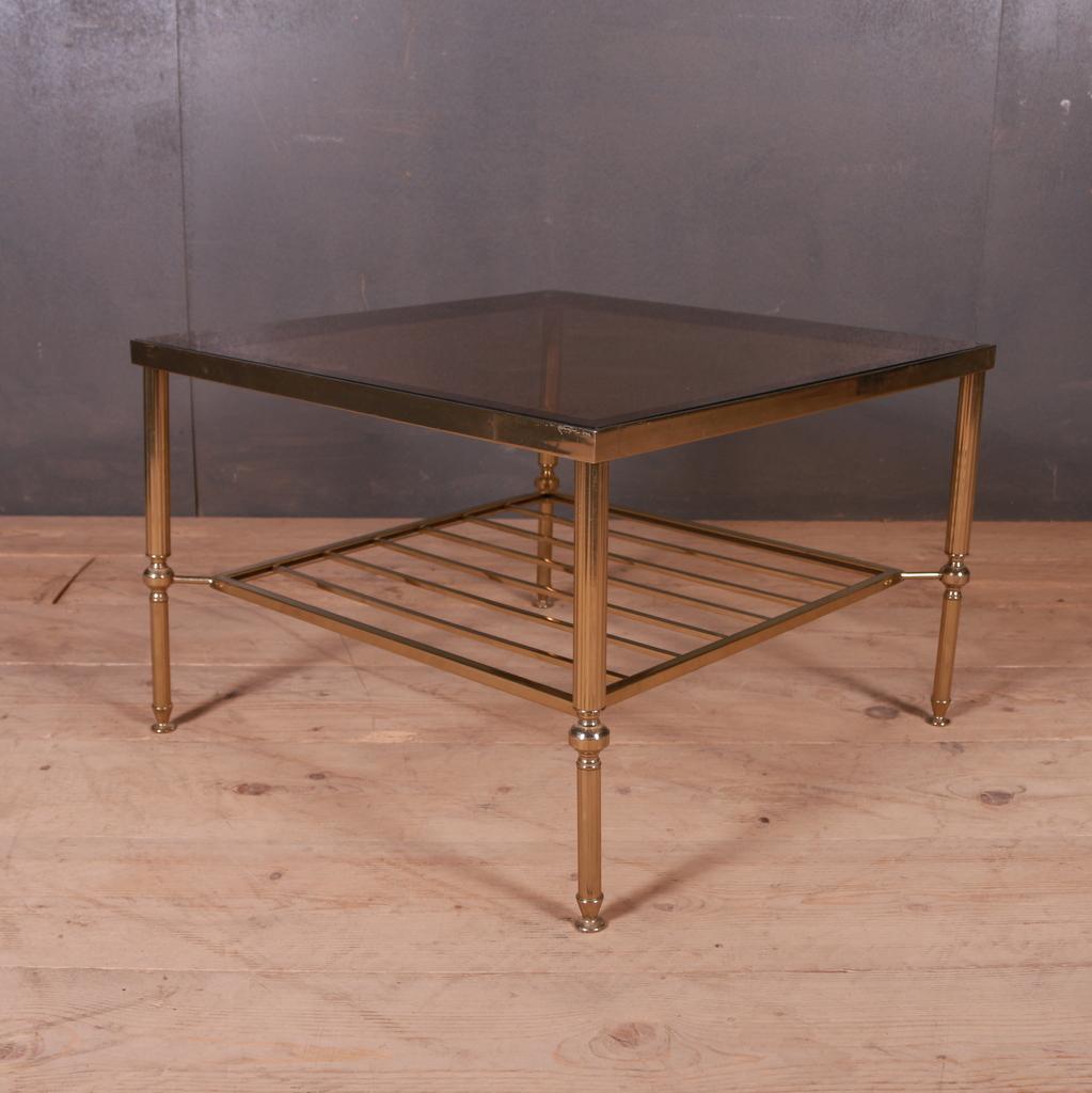 Large 1950s French brass and smoked glass lamp table with slatted under tier, 1950.

One of two.

Ref. C

Dimensions:
24 inches (61 cms) wide
24 inches (61 cms) deep
16 inches (41 cms) high.